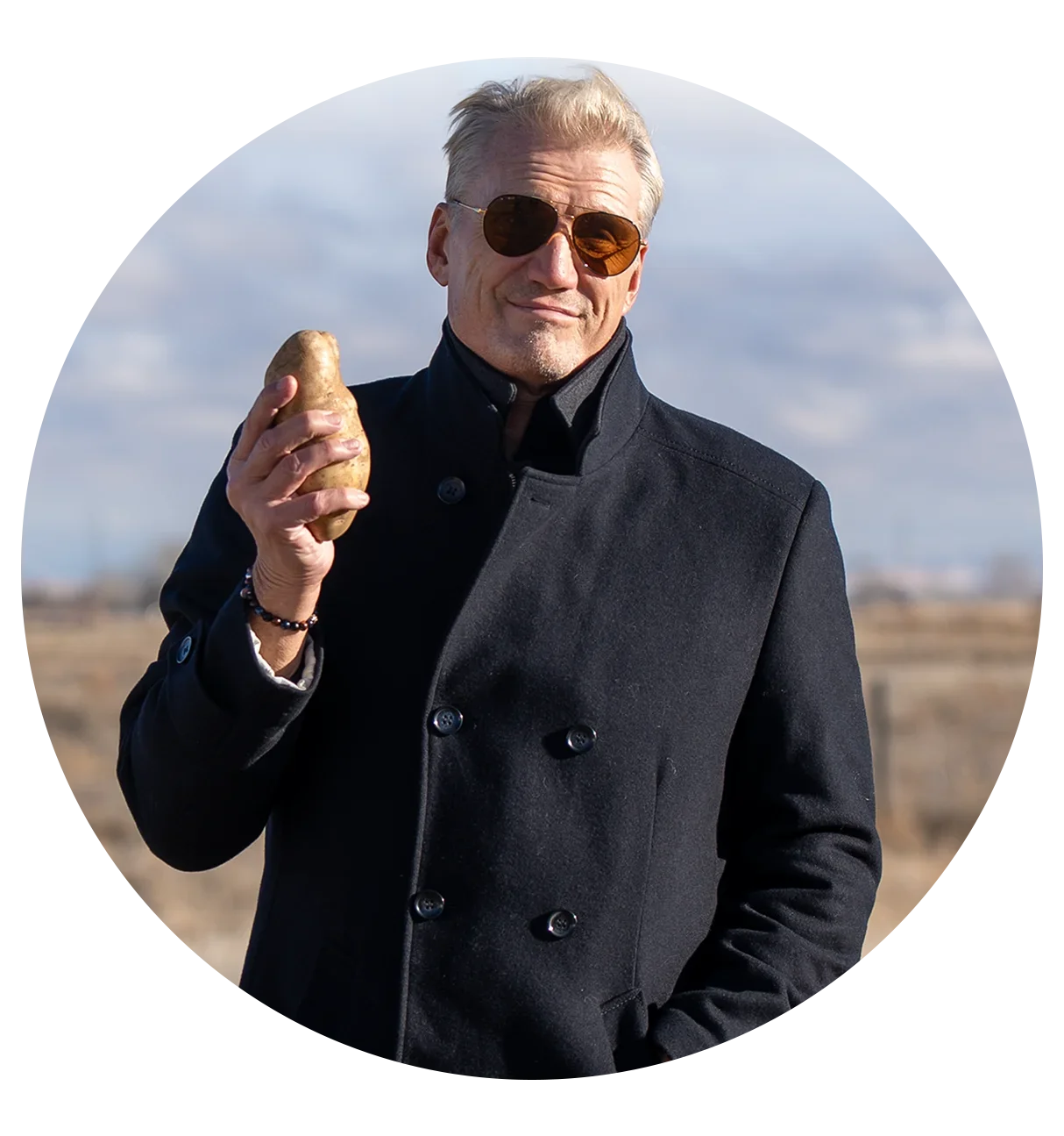 Dolph Lundgren holding an Idaho Russet potato