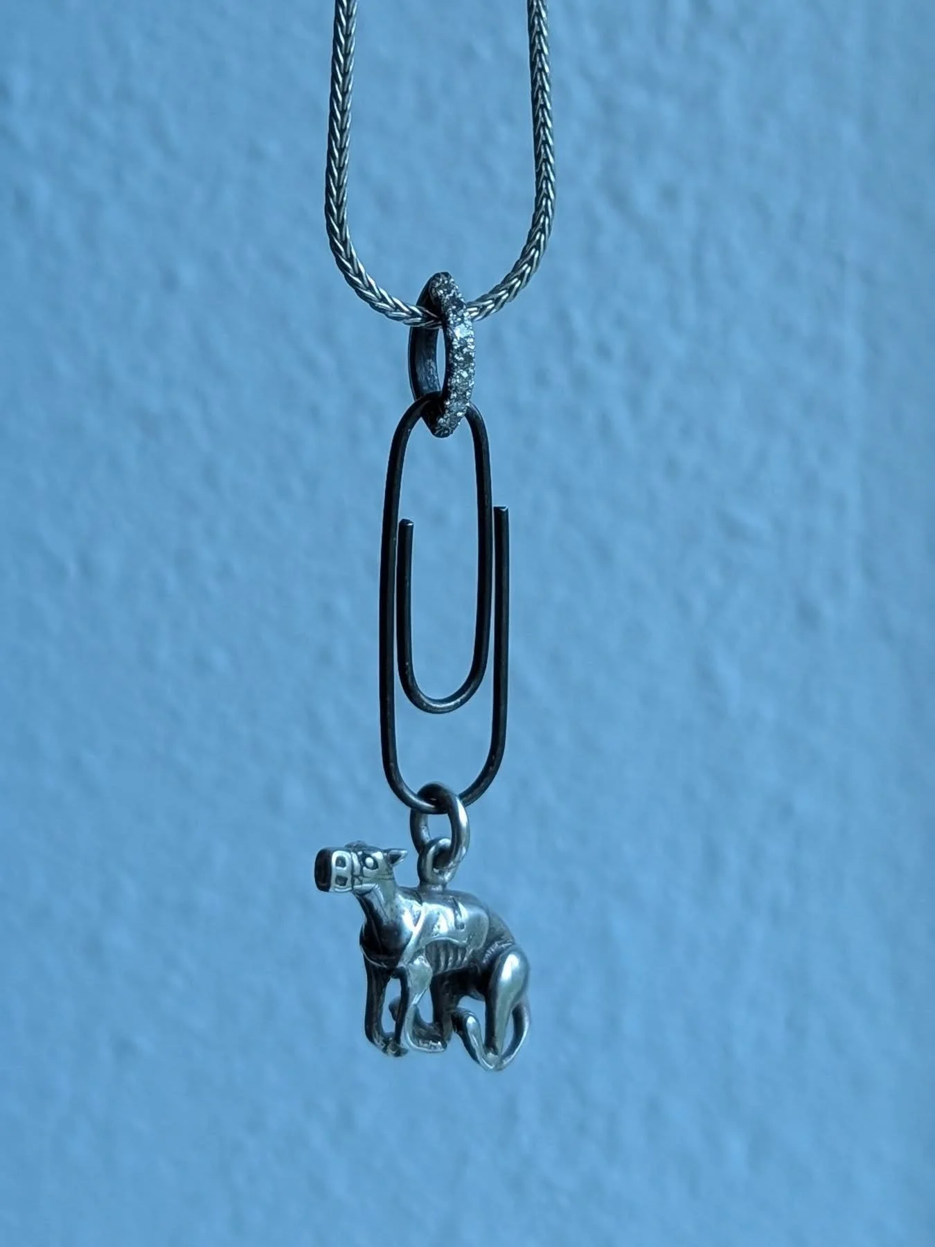 Website is live! 15% discount code on EVERYTHING starts at 7pm tonight! Paperclip charm holder and diamond pav&eacute; bail in oxidized silver. The wire has been drawn down through a draw plate to ensure maximum strength. 

#handmade #charmholder #je