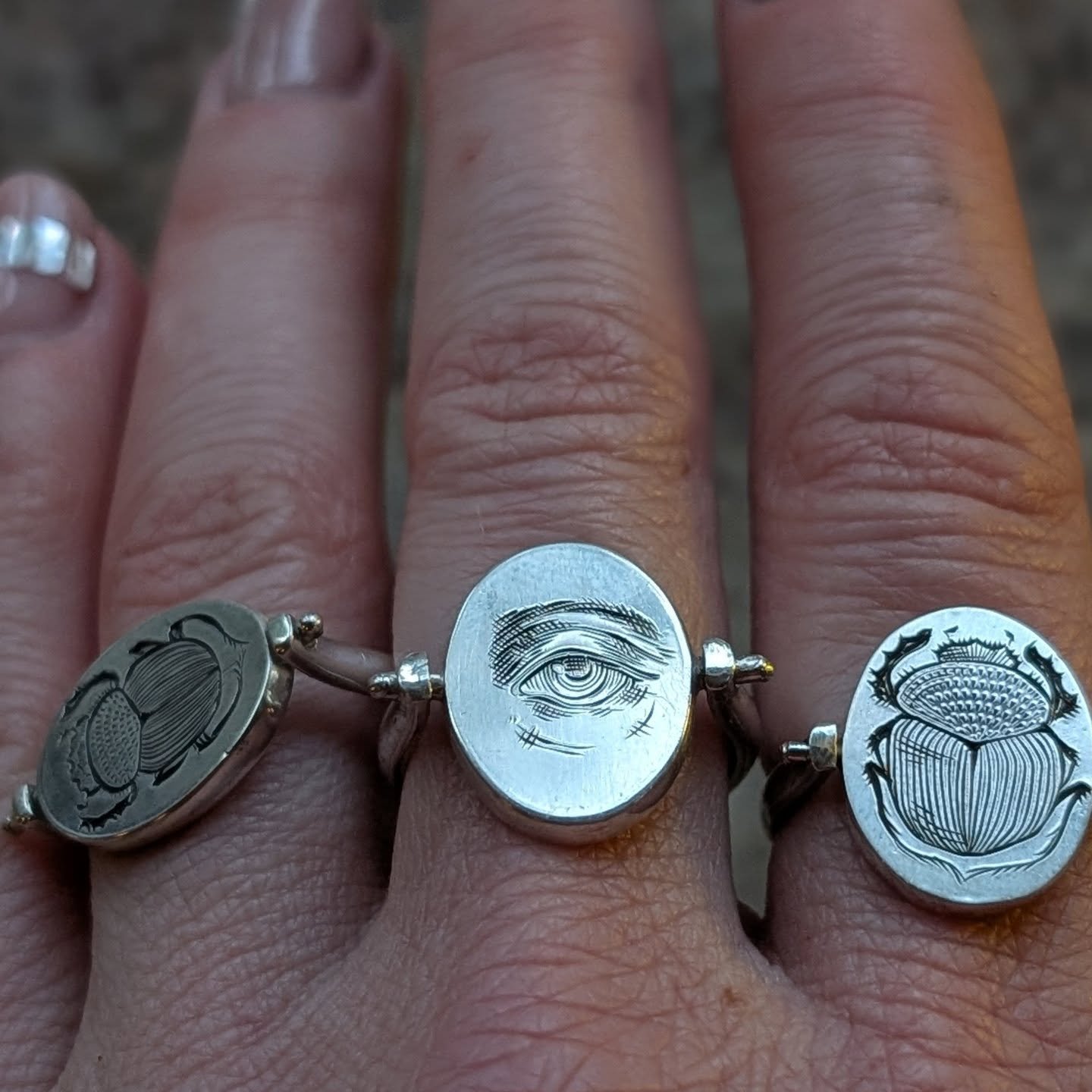I have a lot of jewelry opinions. One of them is that because our jewelry will outlive us, should it be dug up, passed down, found, etc., it should be mysterious and interesting enough to find a new life with someone. Symbol flip rings, hand engraved