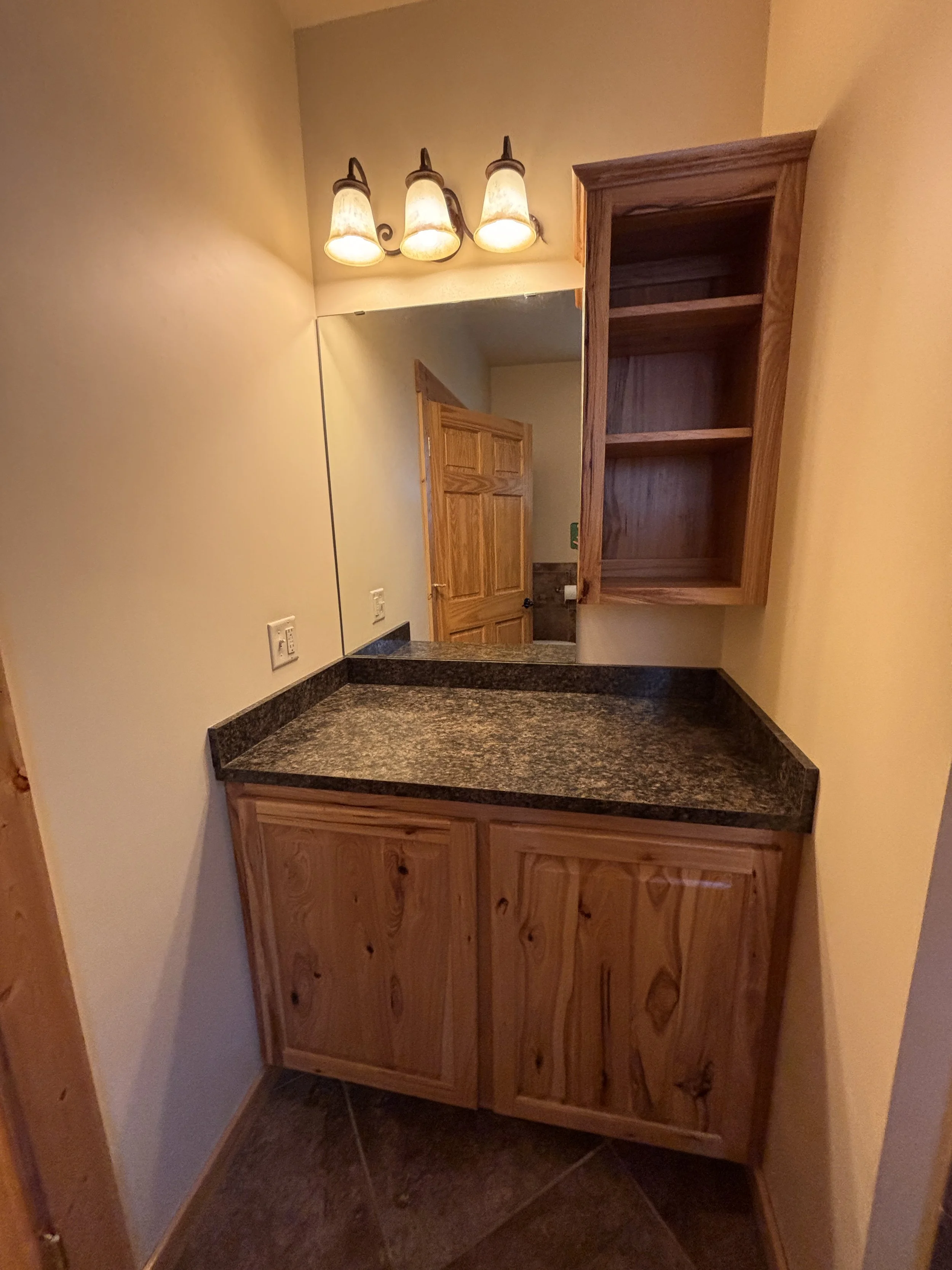 BEDROOM 1 - Main Floor: Queen Suite / Vanity