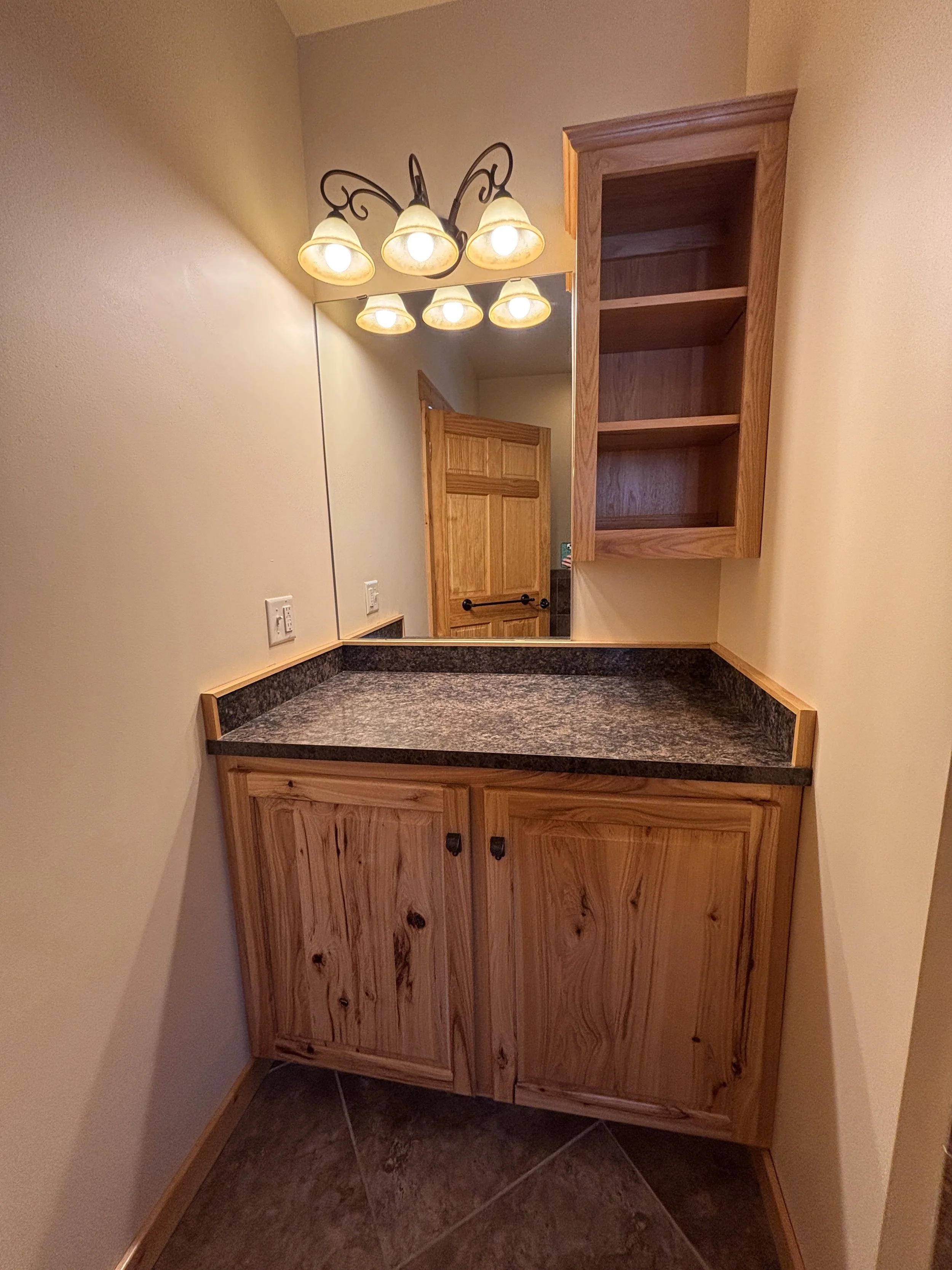 BEDROOM 1 - Main Floor: Queen Suite / Vanity