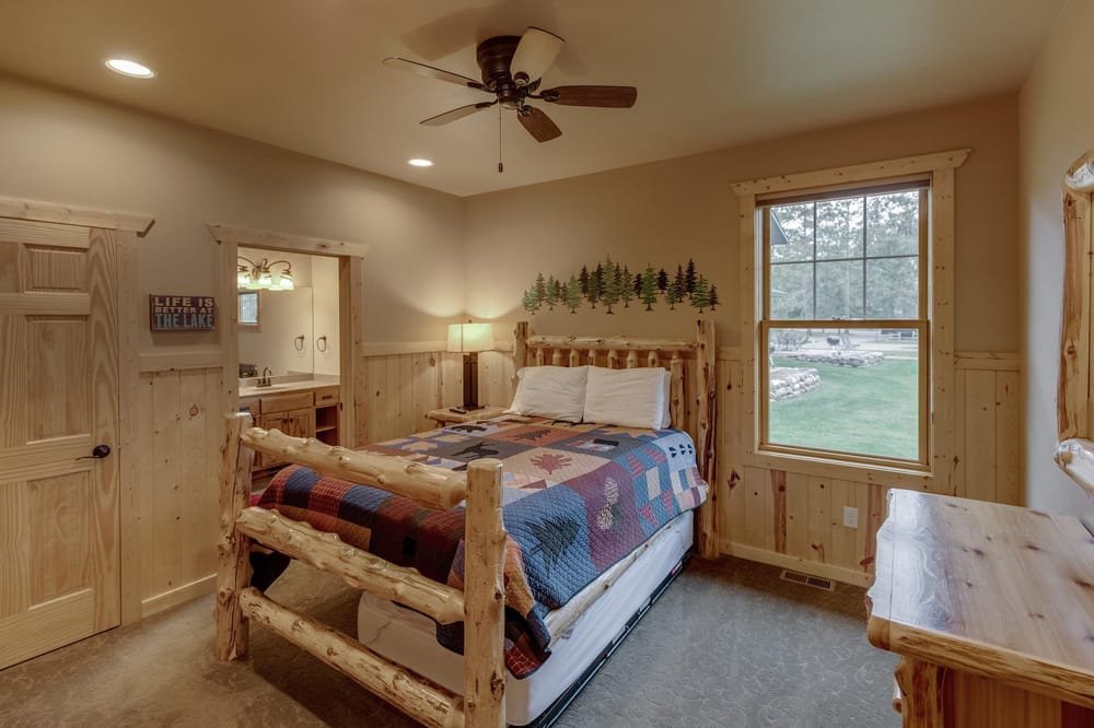 BEDROOM 1 - Main Floor Queen Suite with Twin Trundle