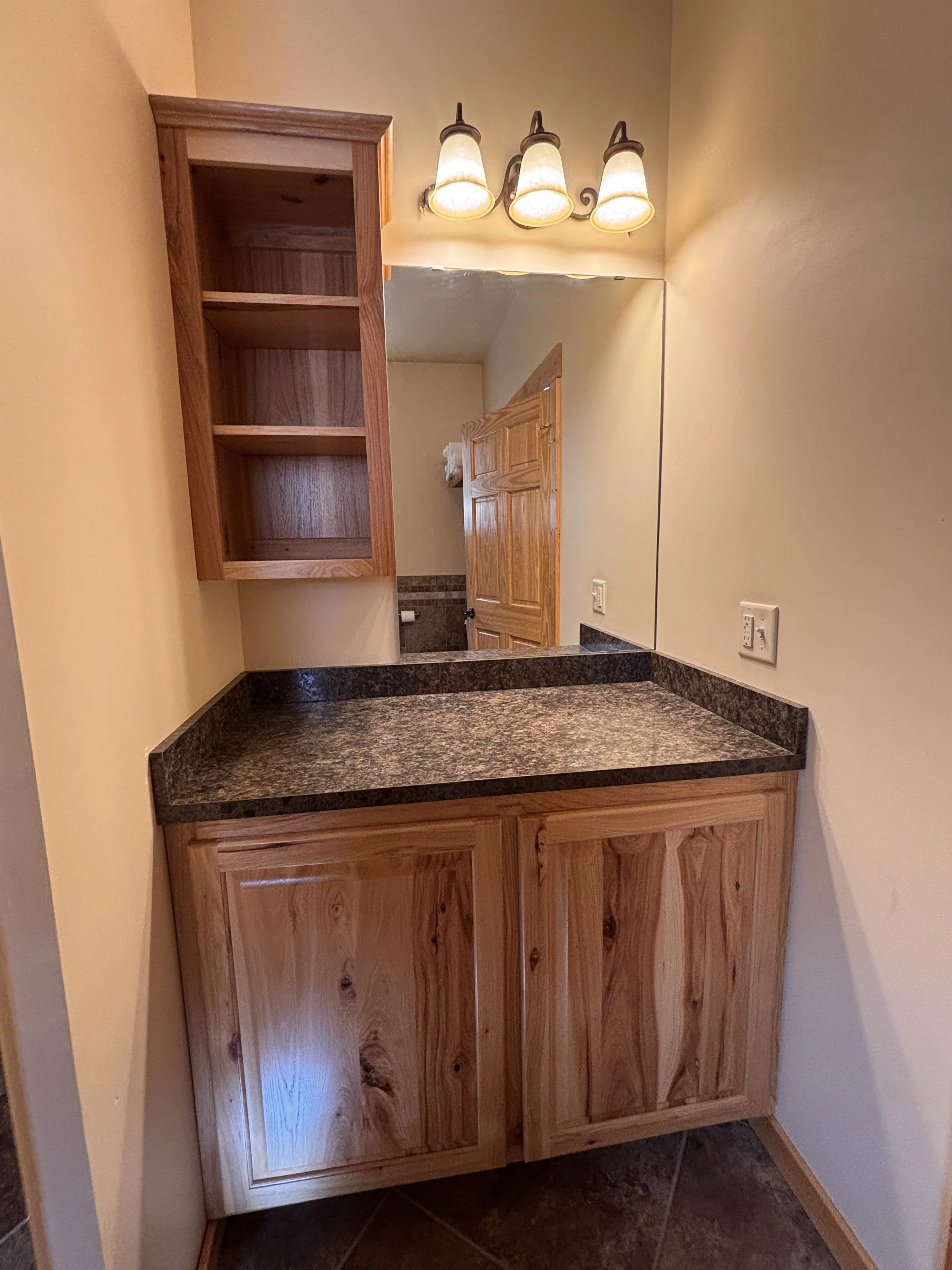 BEDROOM 1 - Main Floor: Queen Suite Bathroom / Vanity