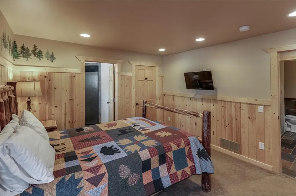 BEDROOM 1 - Main Floor: Queen Suite w/ Twin Trundle