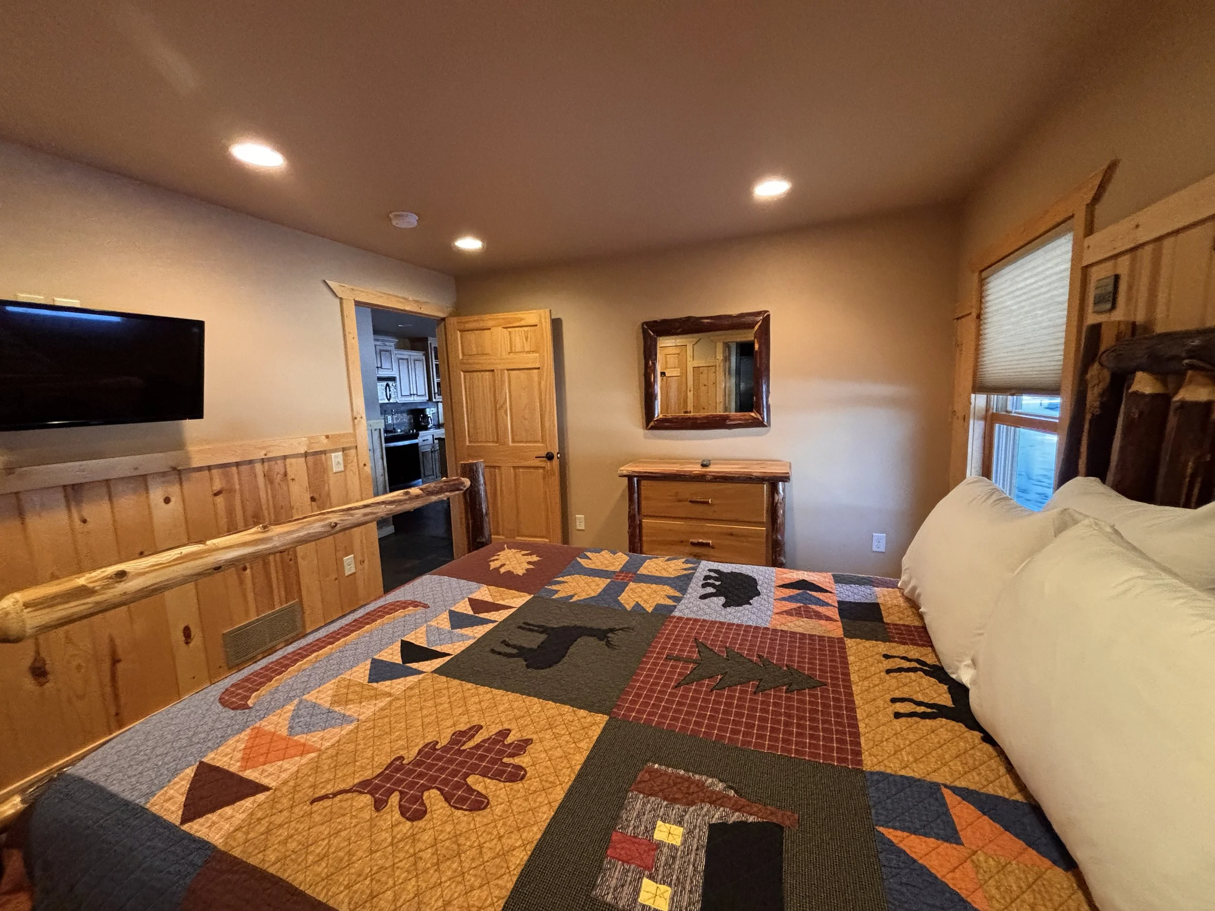 BEDROOM 1 - Main Floor: Queen Suite w/ Twin Trundle