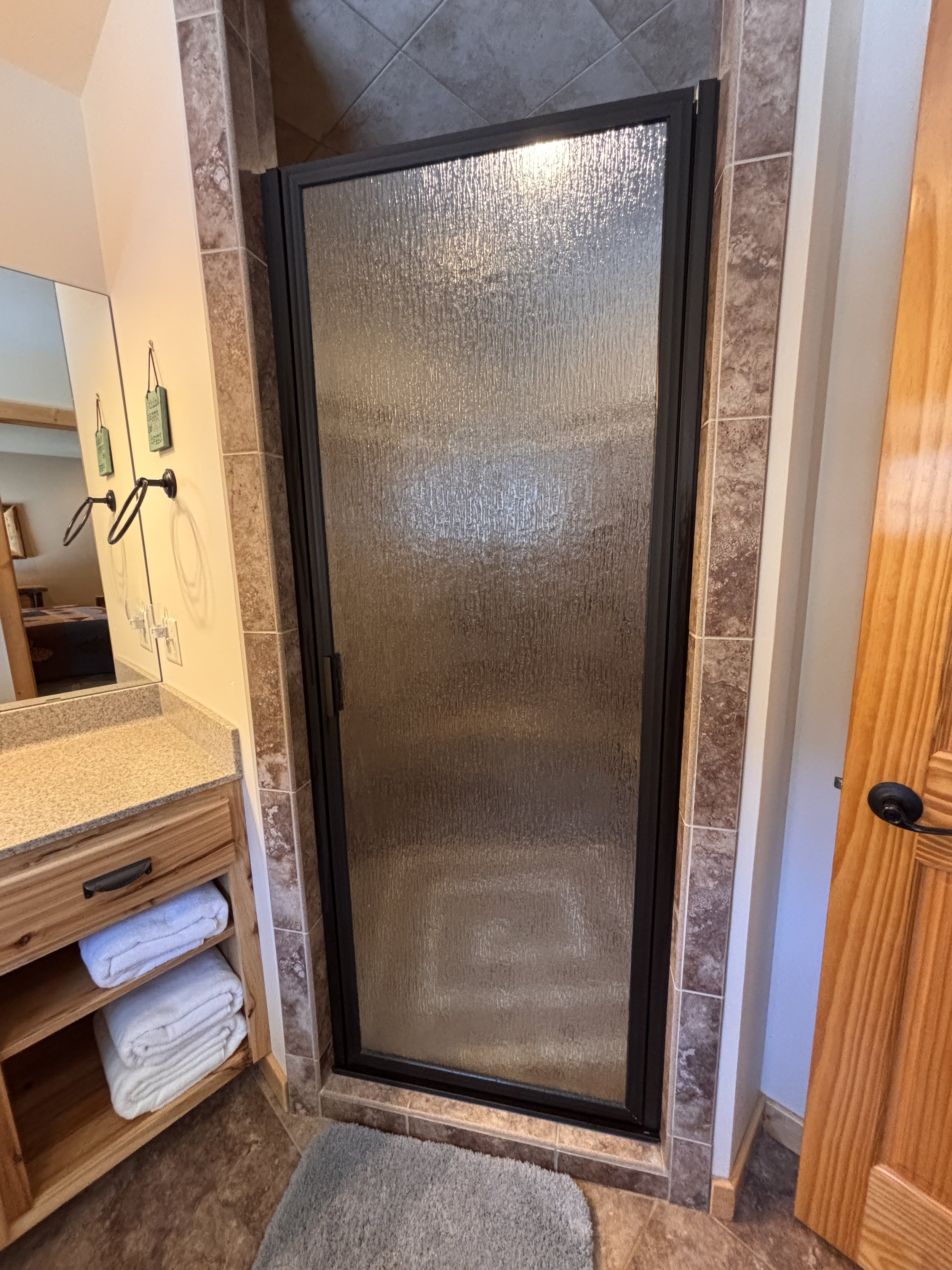 BEDROOM 1 - Main floor: Queen Suite Bathroom / Walk-In Shower