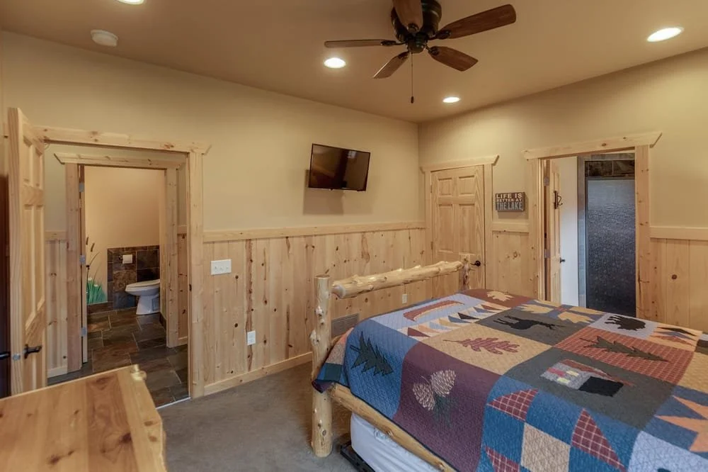 BEDROOM 1 - Main Floor Queen Suite with Twin Trundle