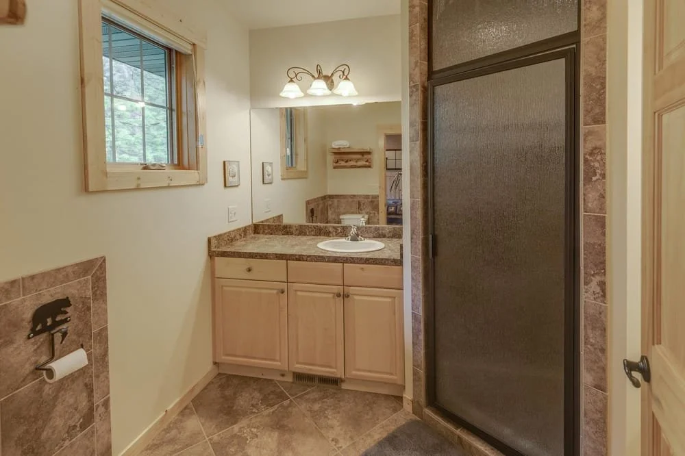 BEDROOM 1 - Main Floor: Queen Suite Bathroom