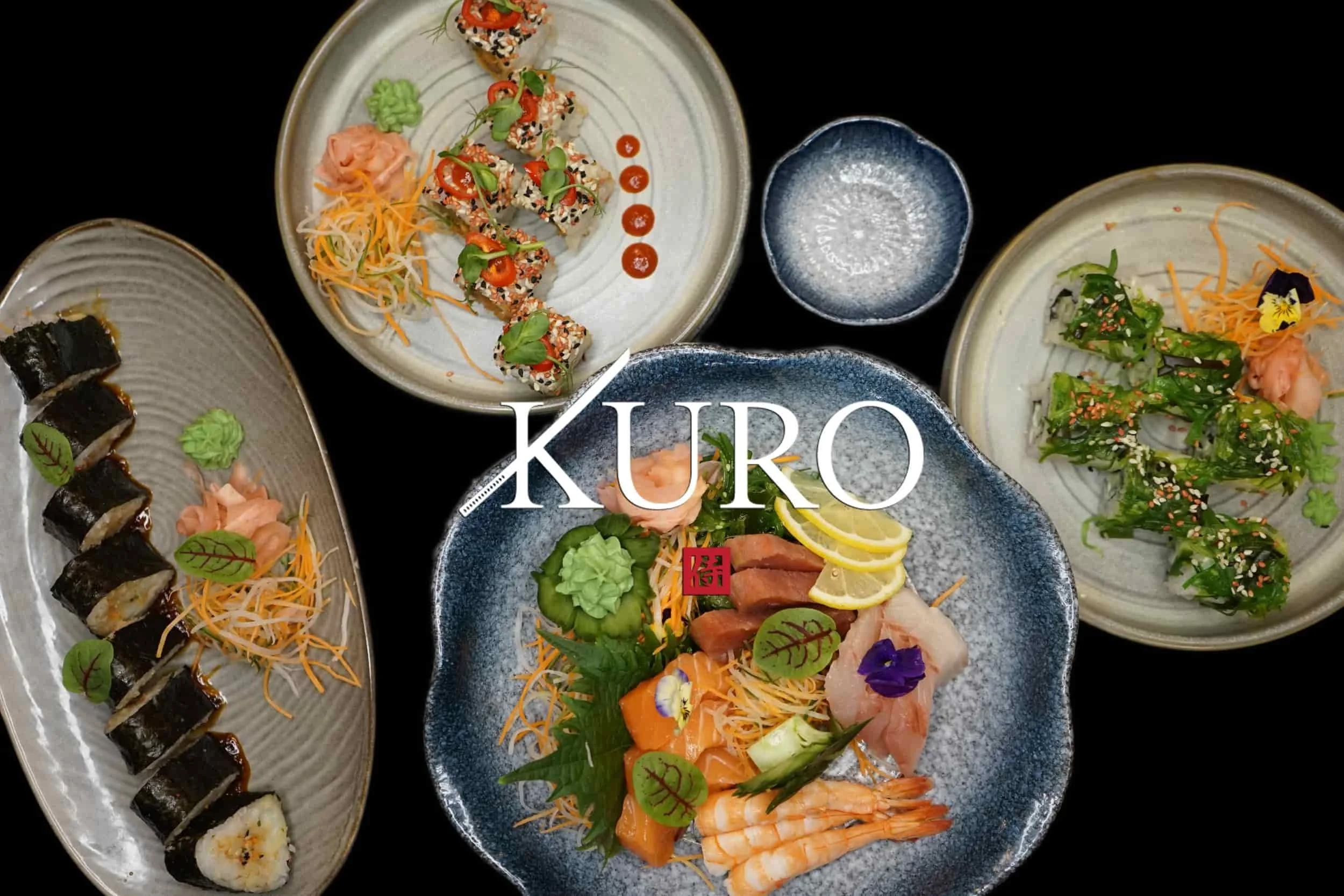 Assorted sushi and sashimi on various ceramic plates with garnishes like sliced lemon, wasabi, and microgreens, set against a black background.