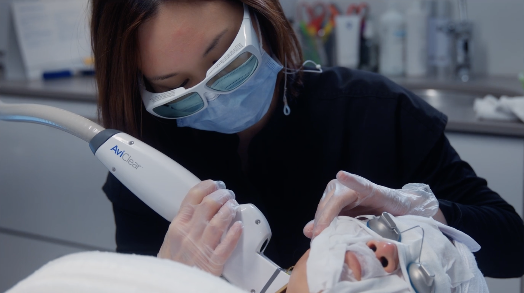 Provider performing AviClear treatment