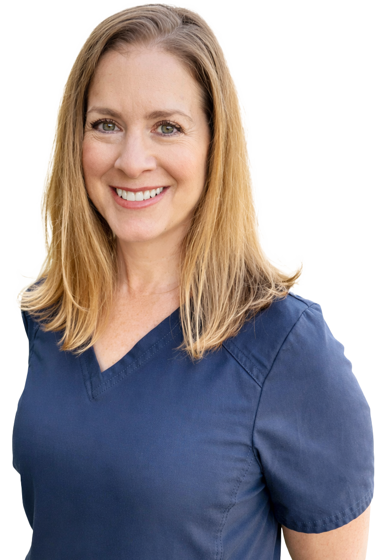A woman with shoulder-length blonde hair, green eyes, and a friendly smile, wearing a navy blue medical scrub top.