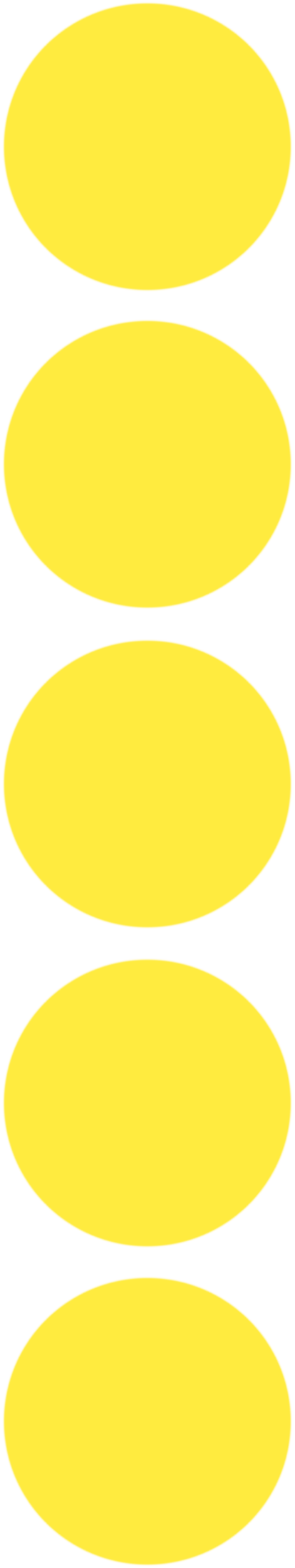 Close-up of a vertical traffic light with three yellow lights on a black background.