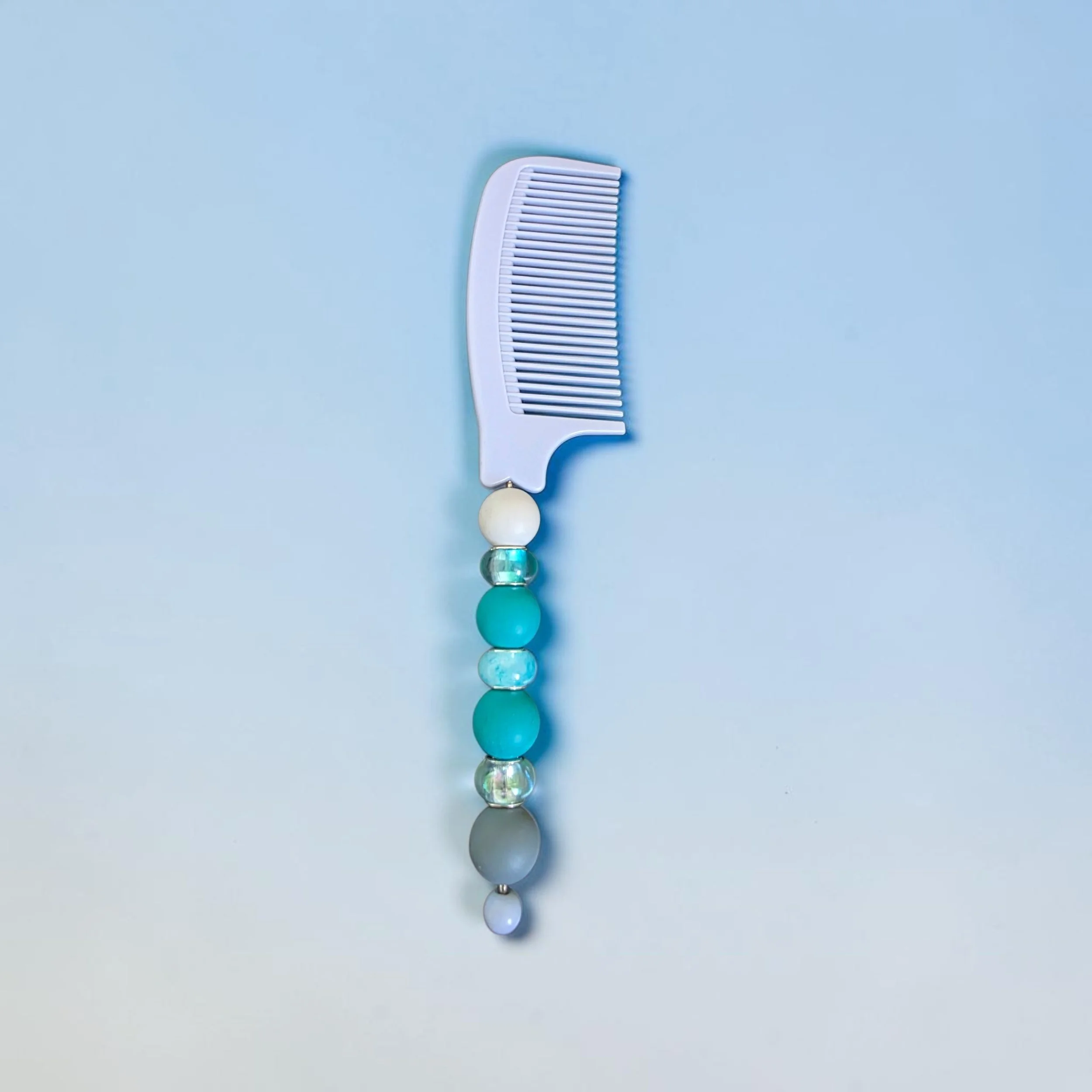Pale blue beaded comb