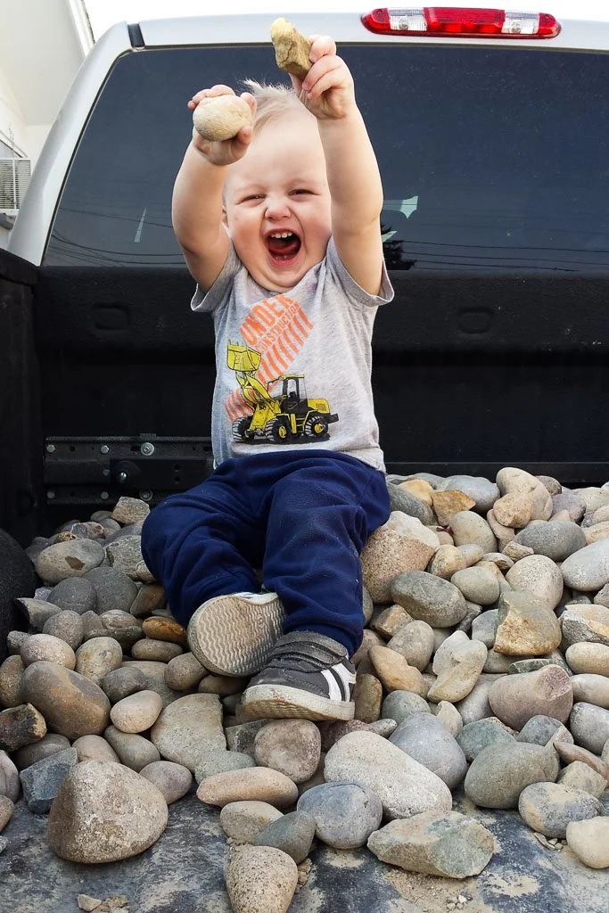 Rusted-Rose-Studios_Rusted-Rose-Studios_child-toddler-playing-rocks-truck-bed_01_01.jpg