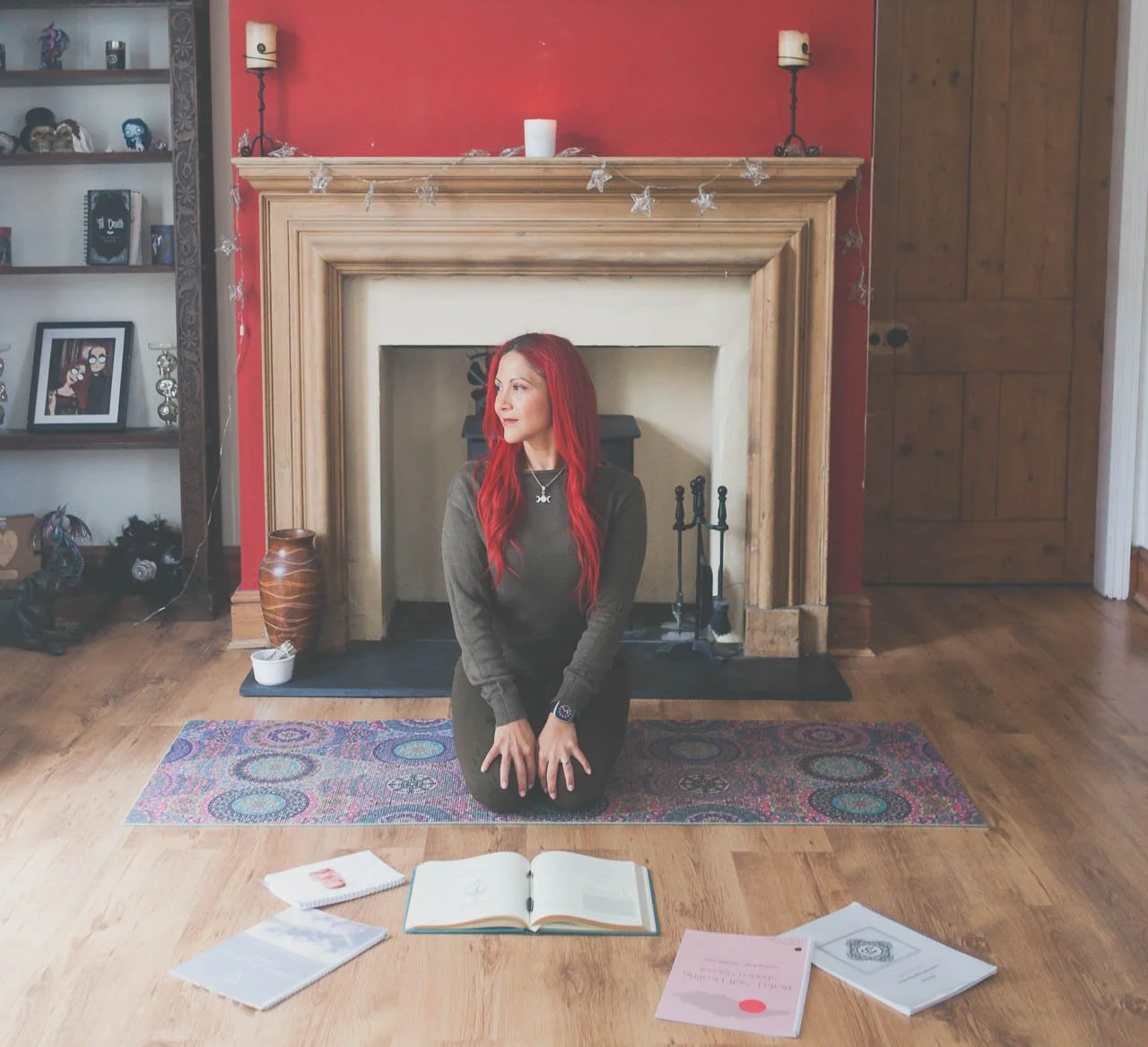 Lianna kneeling on a yoga mat