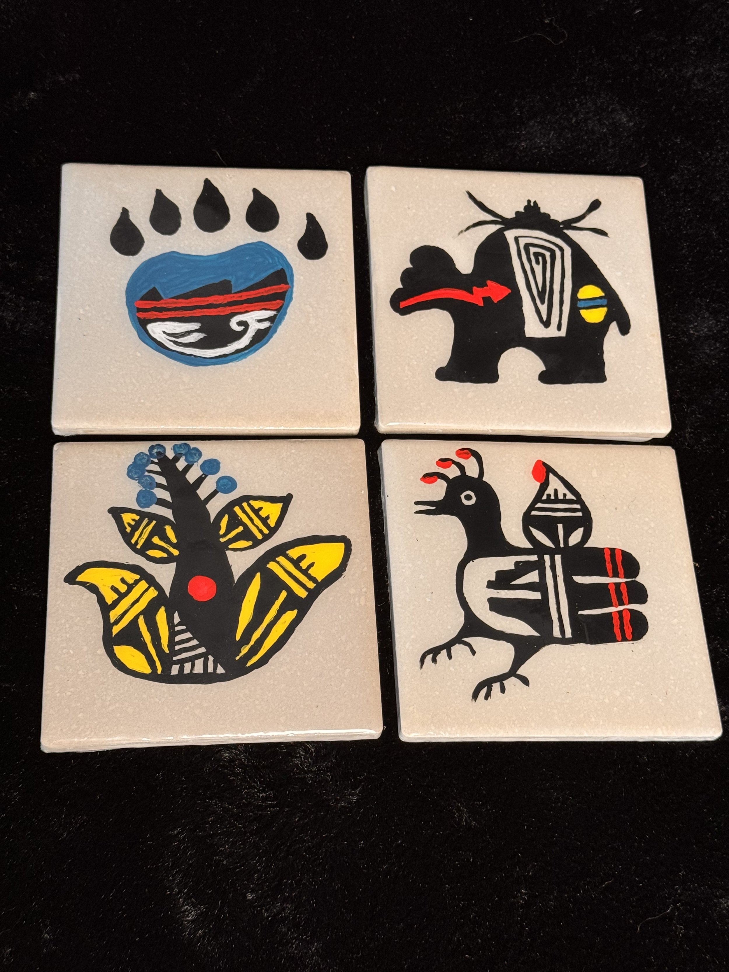 Hand painted ceramic coasters. Set of 4 includes all 4 designs.