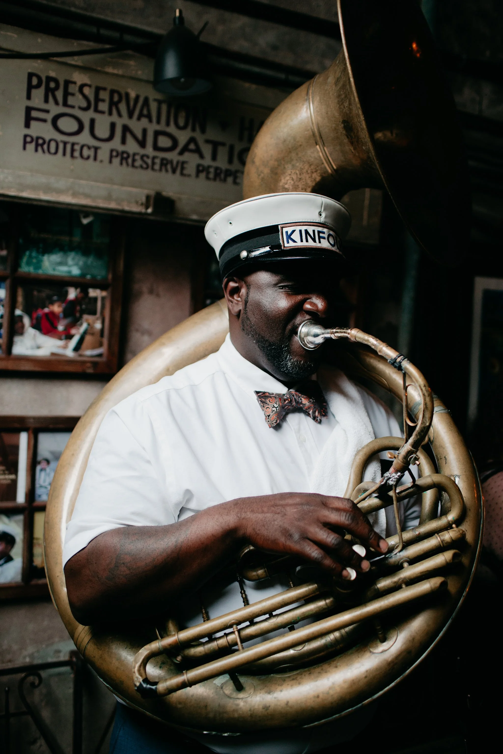 Laurie’s customers, Mariana and Carmen holding hands on a green lawn on their wedding day.