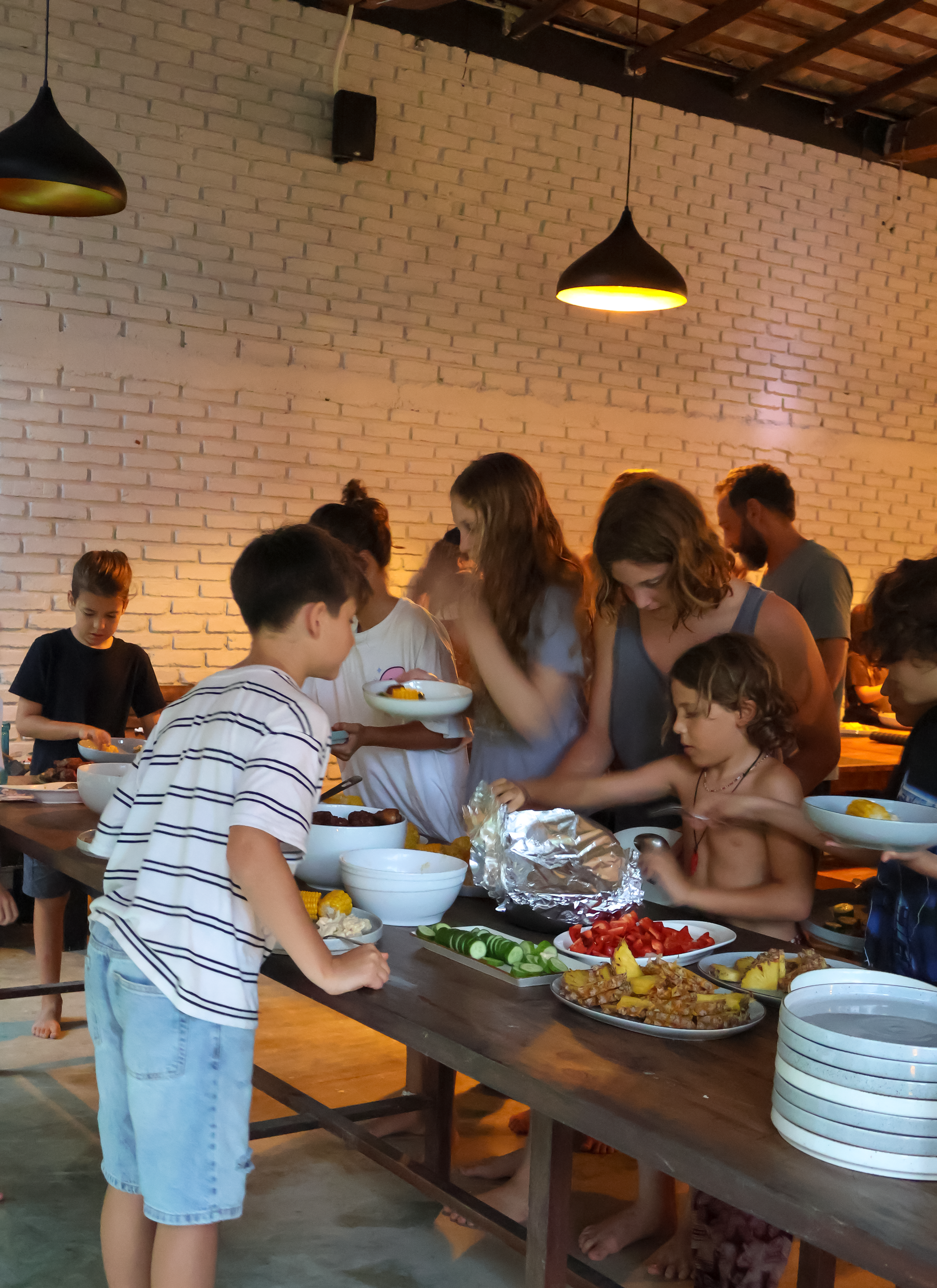 kids and teens in Sri lanka serving themselves at a community cook event