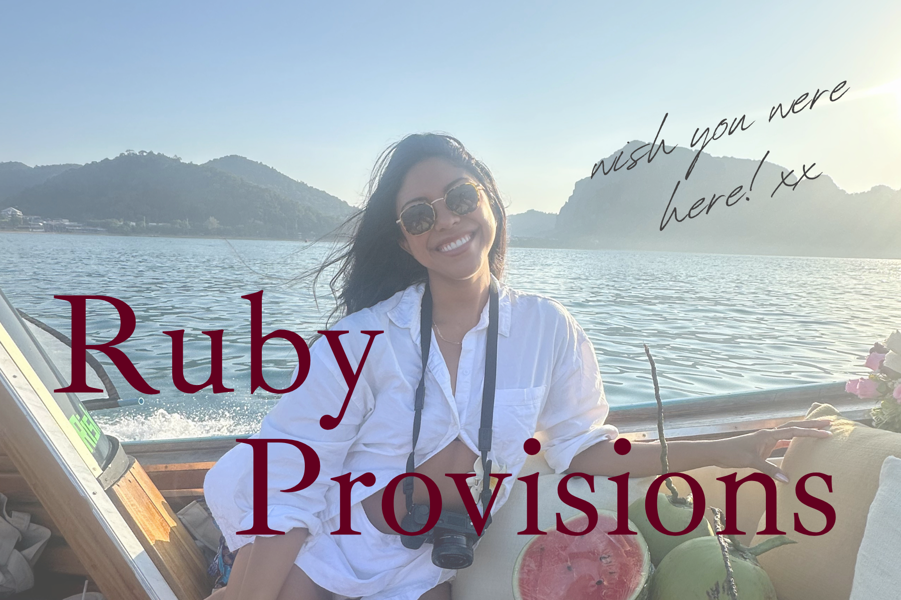 Girl on a boat with a camera, with the font wish you were here