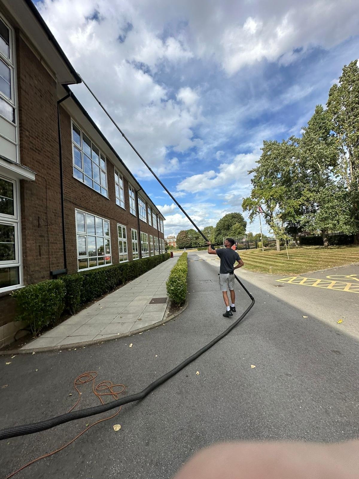 high reach gutter clearing at local school