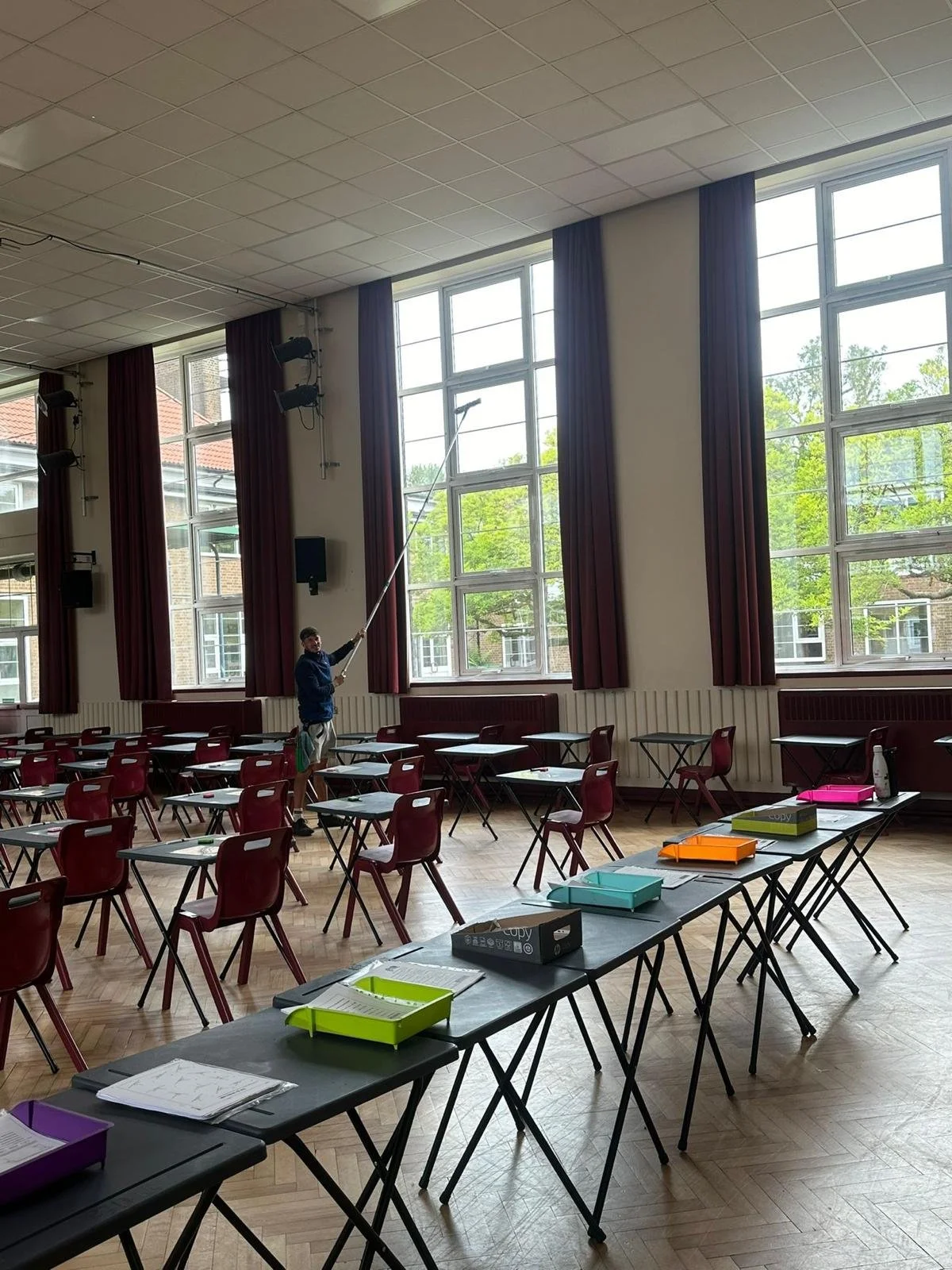 me cleaning interior windows of a school with window cleaning pole for streak free finish