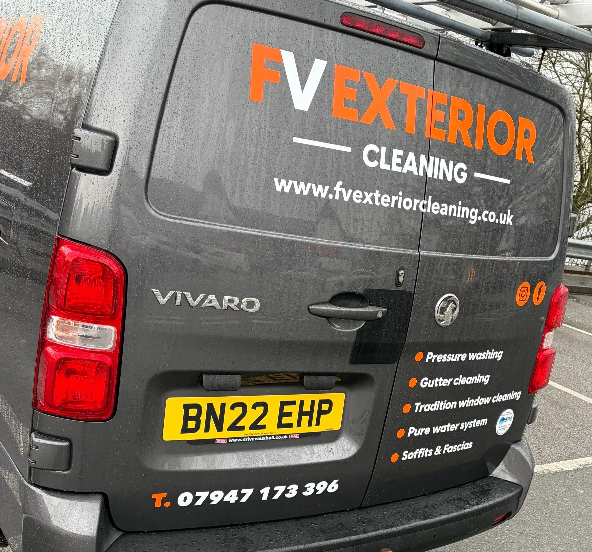 A gray Vauxhall Vivaro van with branding for FV Exterior Cleaning, including the website www.fvexteriorcleaning.co.uk, phone number 07947173396, and icons for Instagram and Facebook. The services listed are pressure washing, gutter cleaning, traditional window cleaning, pure water system, and soffits & fascias.