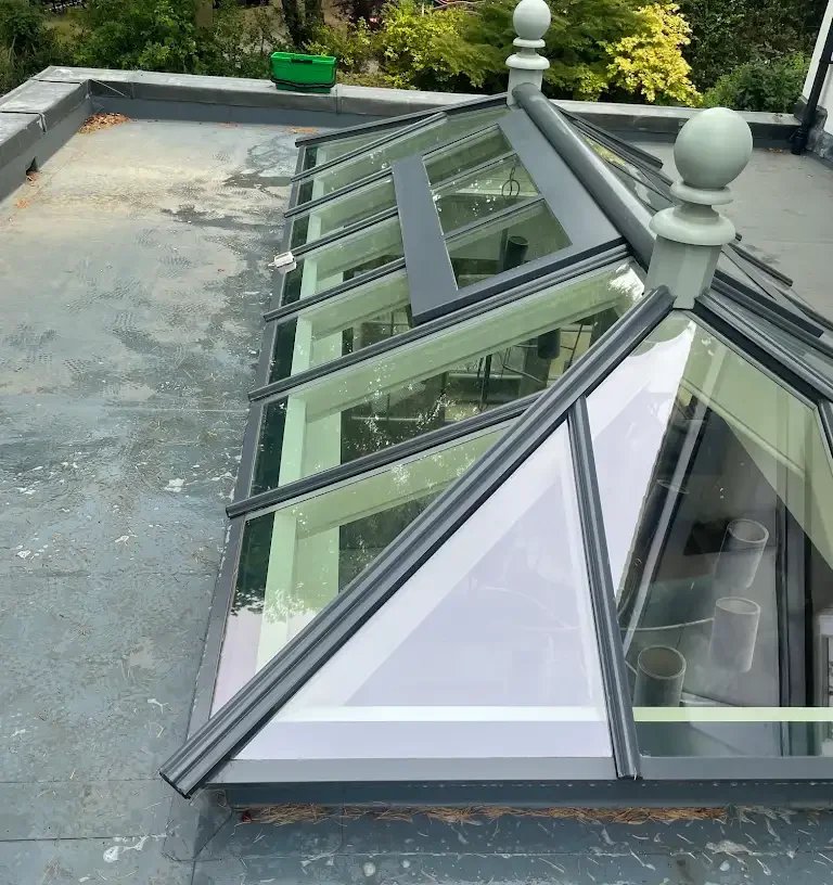 Professional glass lean-to roof cleaned to a spotless, streak-free finish in Watford