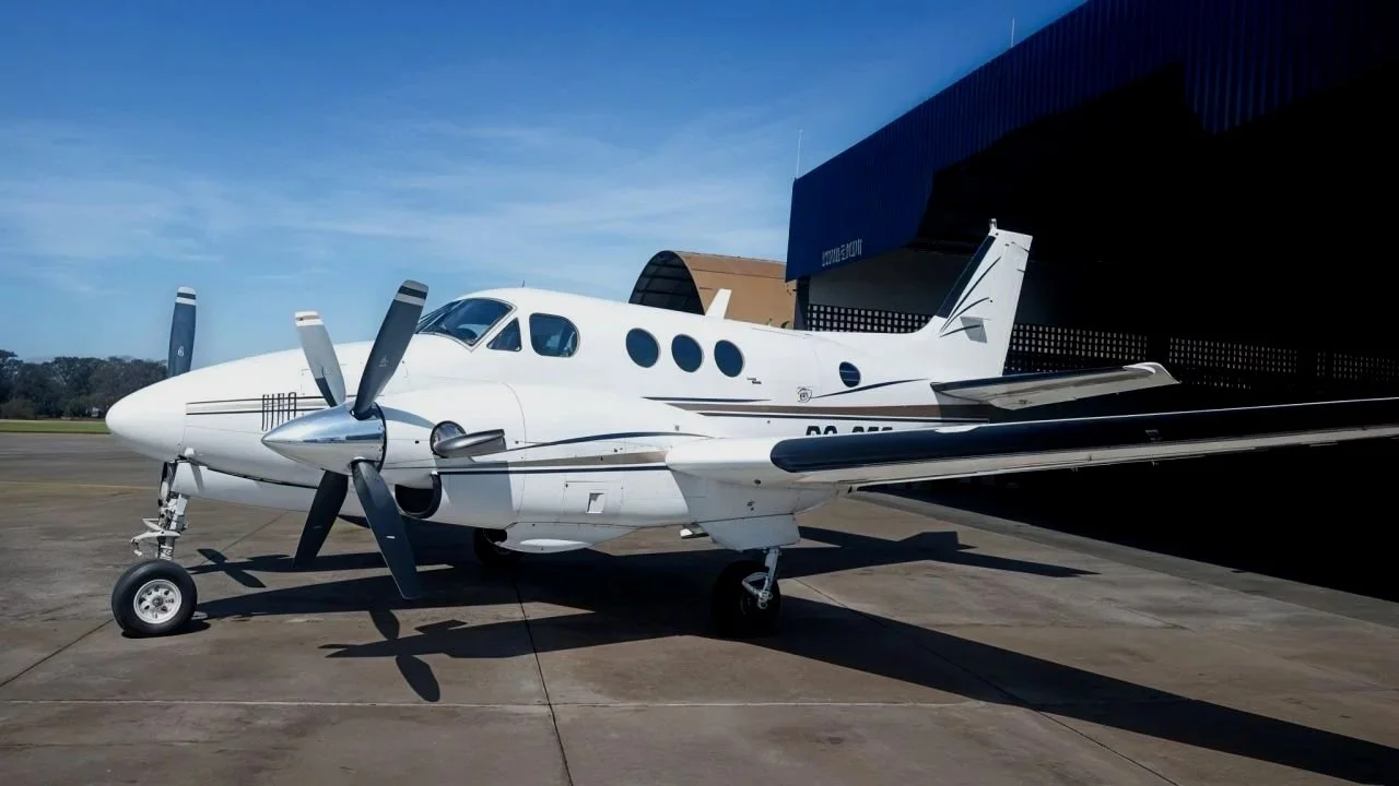 A recently sold, King Air E90 sits on the ramp.