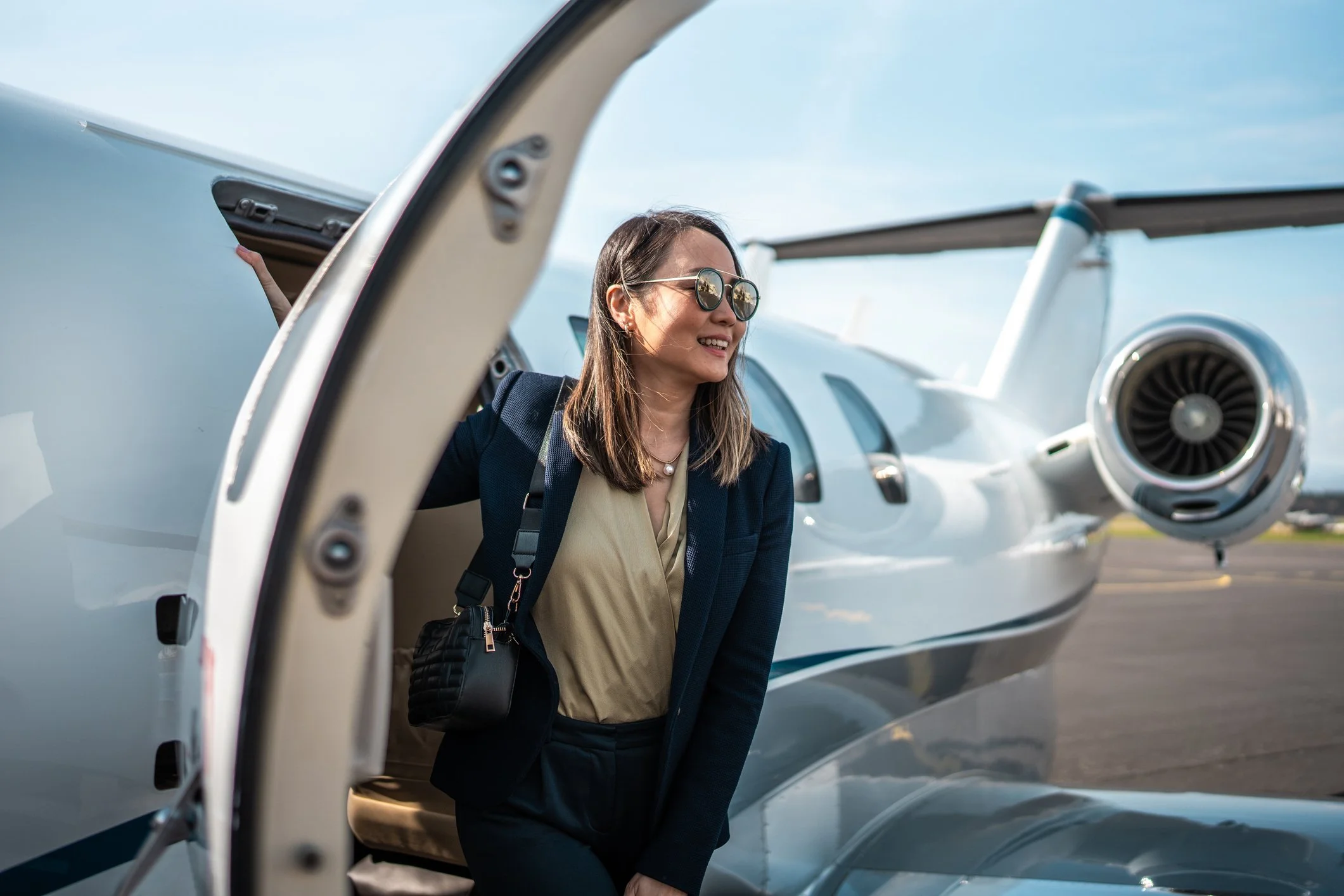 A young woman steps out of a Citation Jet in Carson City, Nevada near Lake Tahoe.