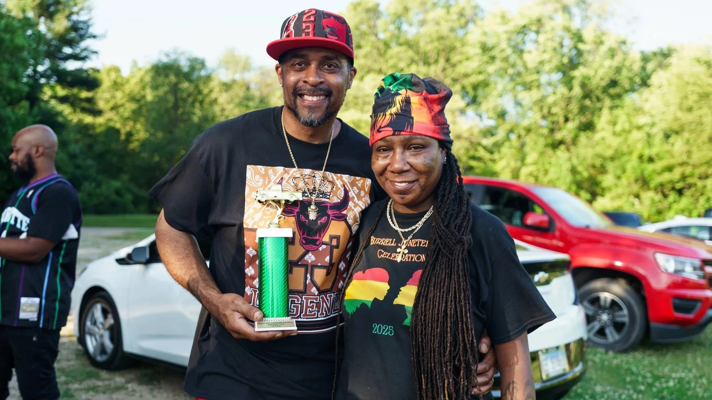 Founder ReElla Burrell with Winner Dedrick Jones at Kalamazoo Michigan Juneteenth Celebration. 