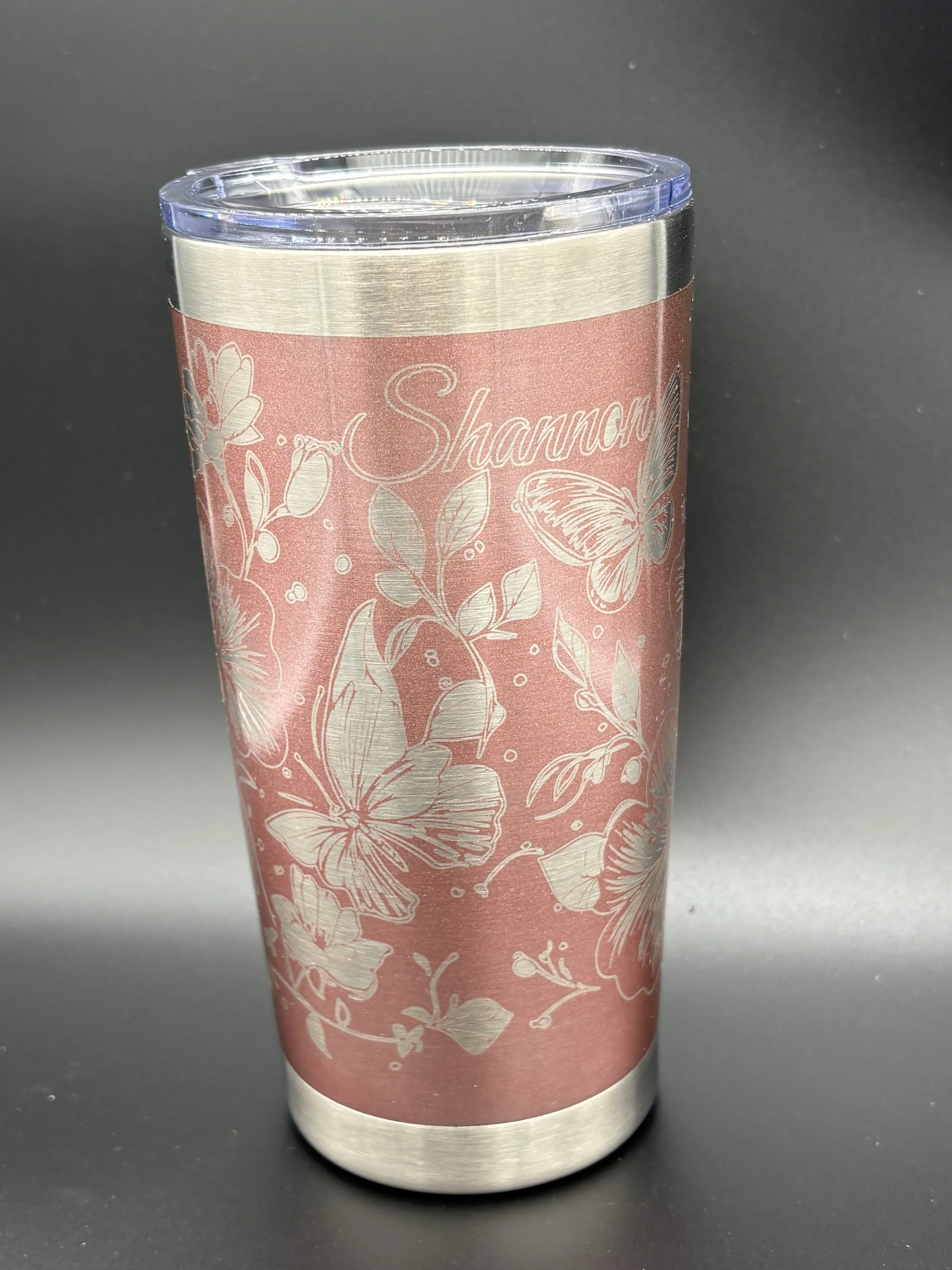 Pink tumbler engraved with butterflies