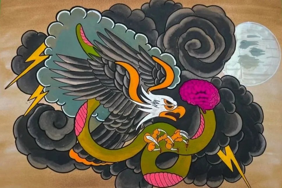 A colorful tattoo of a fierce eagle entwined with a green snake, surrounded by dark clouds, lightning bolts, a full moon, and a pink cloud of smoke.