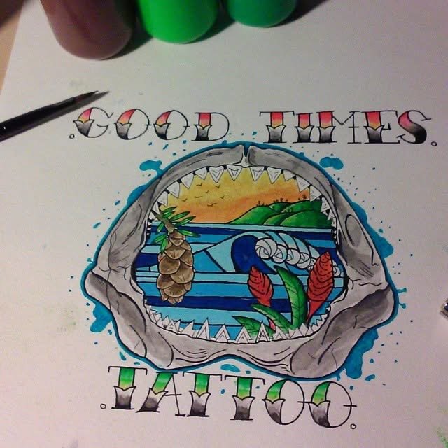 Colorful drawing featuring the words "Good Times" with tropical scenery inside a large open mouth resembling a shark's head, including a pineapple, two red leaves, and a beach scene with water, hills, and a sunset in the background.