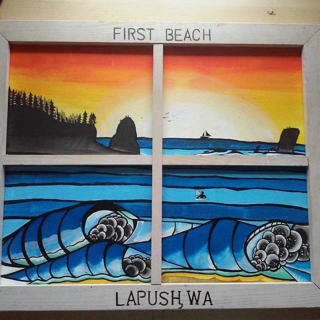 Mural depicting the first beach with ocean waves, a sailboat, and a sunset sky, framed with a wooden border labeled 'First Beach' at the top and 'Lapush Wa' at the bottom.