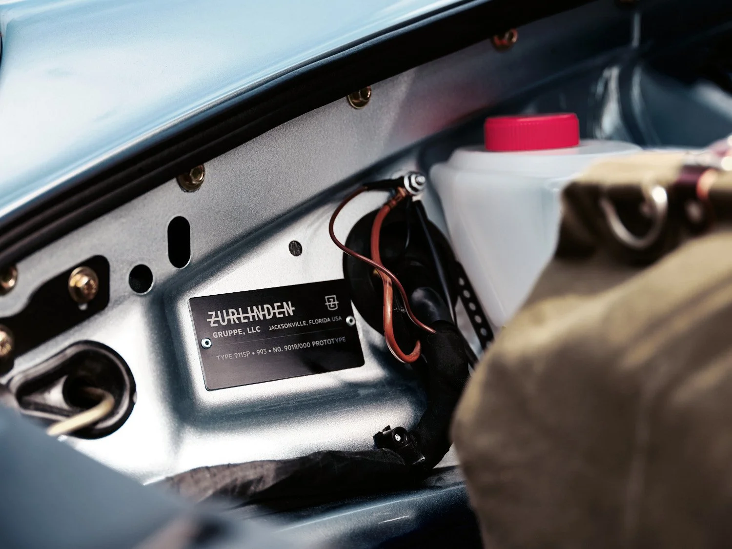 Close-up of a label inside a car, showing the name 'ZurLanden' with information about the manufacturer, location, and prototype number.