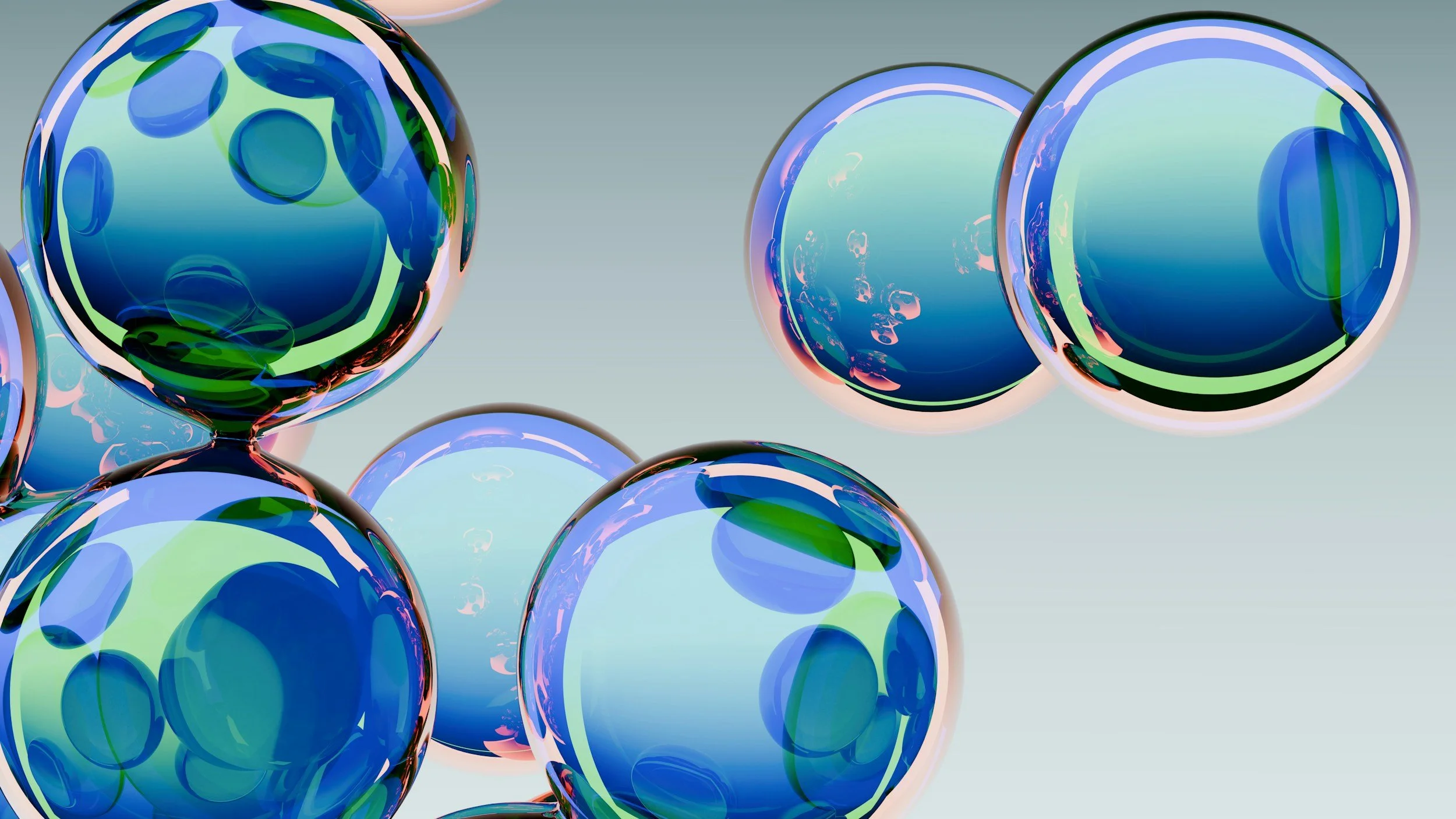 A group of colorful, glossy, spherical shapes with blue, green, and purple patterns, floating against a light gray background.