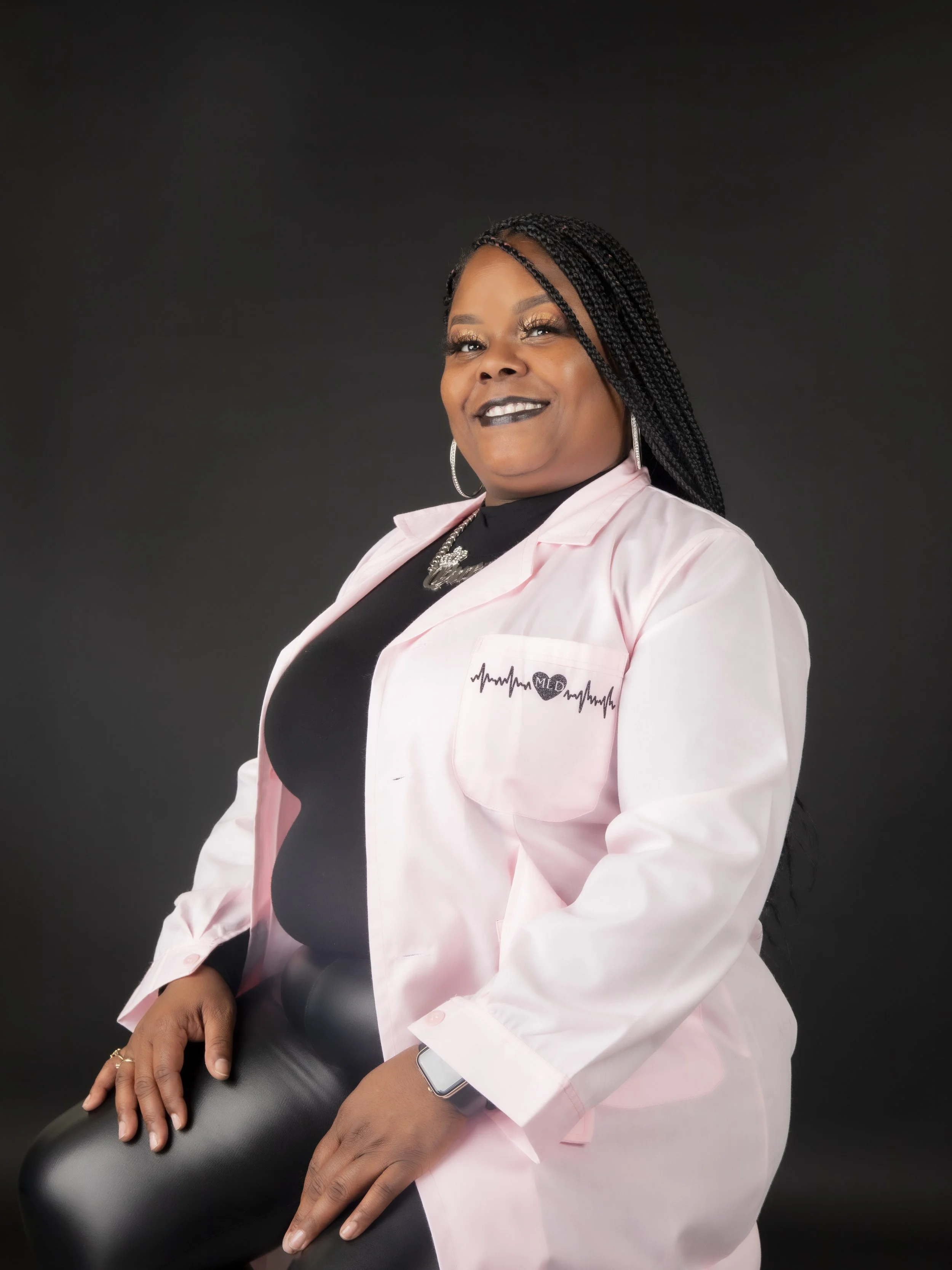 Woman in a medical coat posing for a personal branding portrait with T3 Mobile Studio.