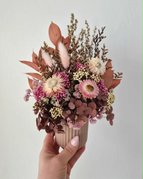 Mixed purple, orange and cream dried flower arrangement