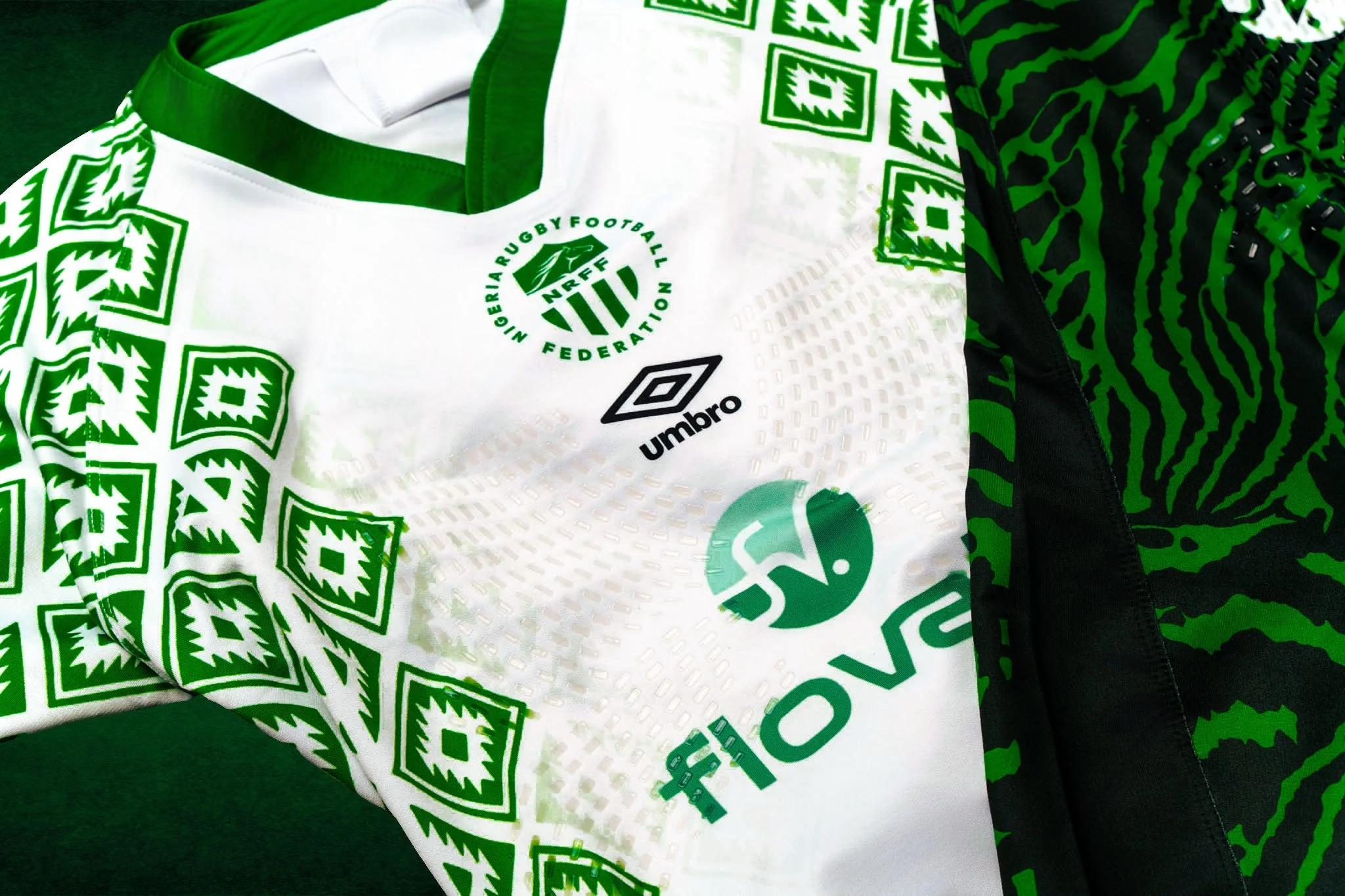Close-up of a Nigeria rugby jersey with green and black patterns, featuring logos of Nigeria Rugby Football Federation, Umbro, and Nike.