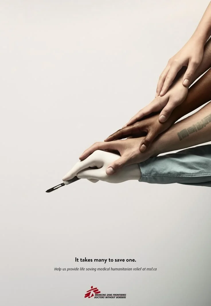 A hand holding a blood lancet, with multiple other hands stacked on top, representing different skin tones, in a medical or humanitarian context. The text reads: "It takes many to save one. Help us provide life saving medical humanitarian relief at msf.ca." The logo of Doctors Without Borders is at the bottom.