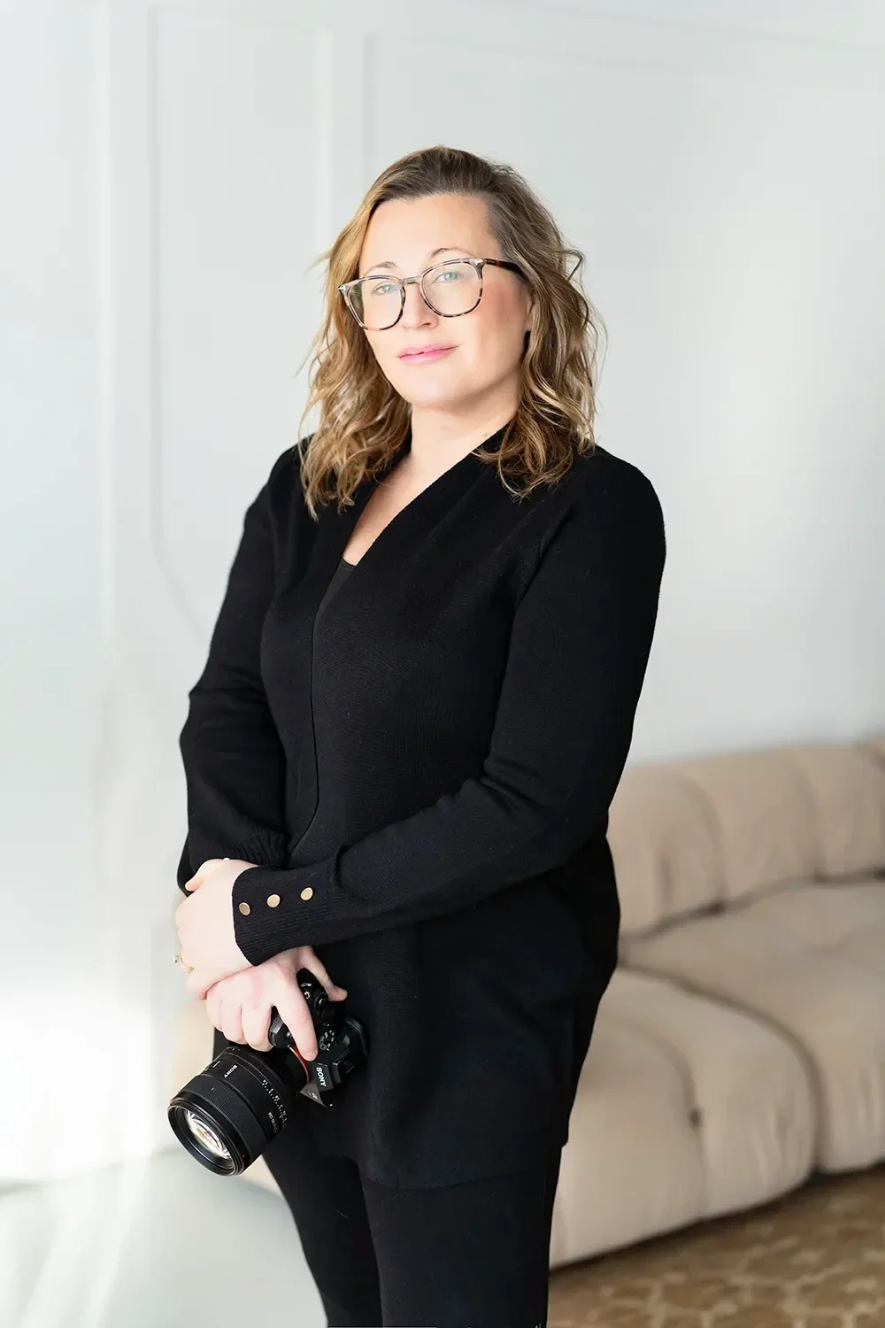 toronto photographer holding a camera