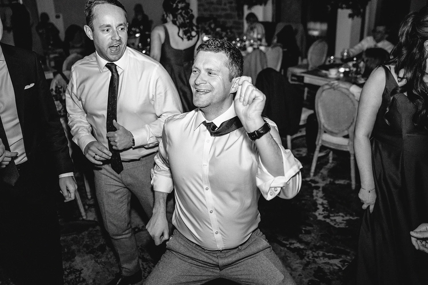 People dancing and enjoying themselves at the wedding during the reception 