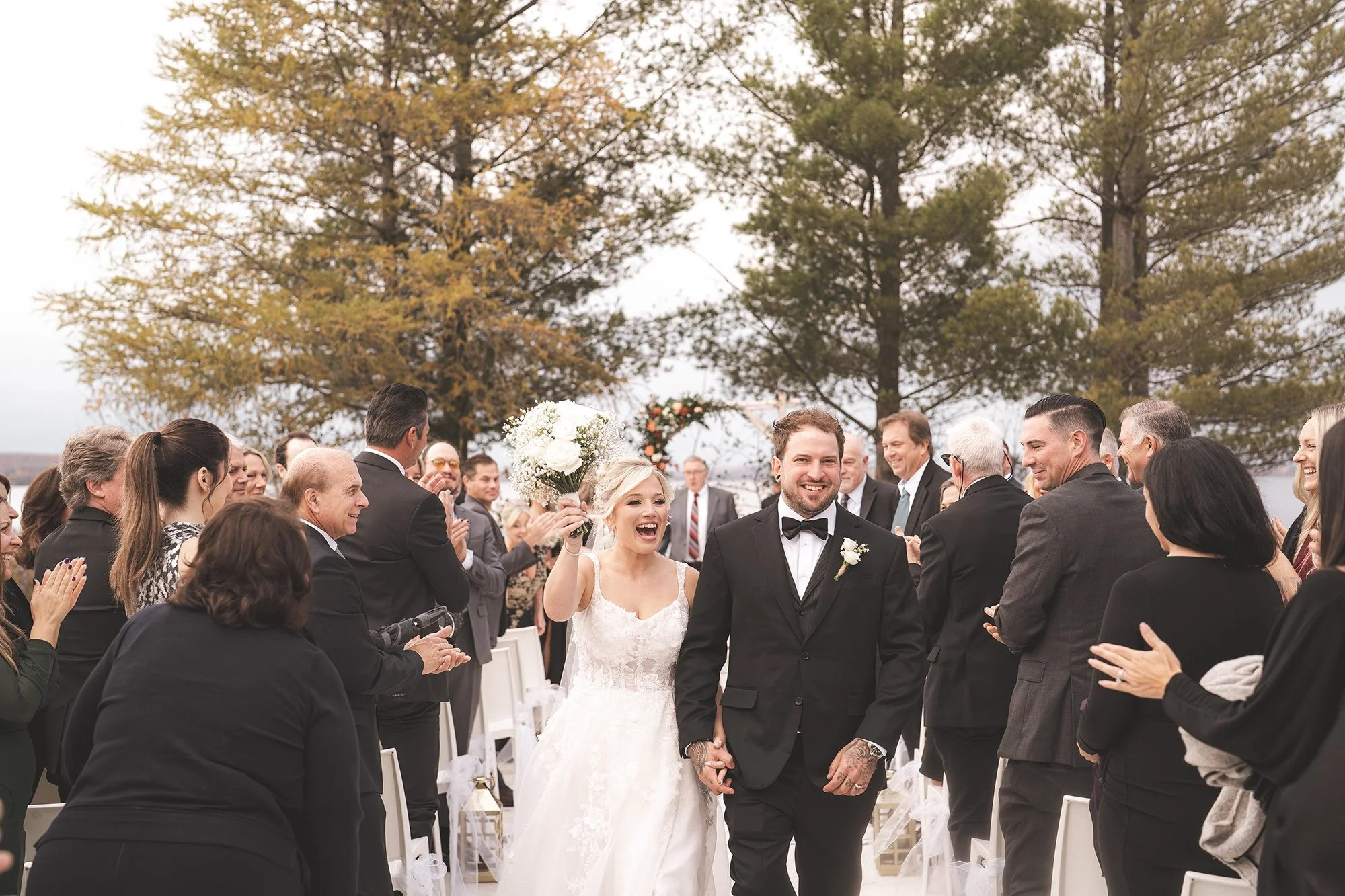 bride and groom walking down the isle