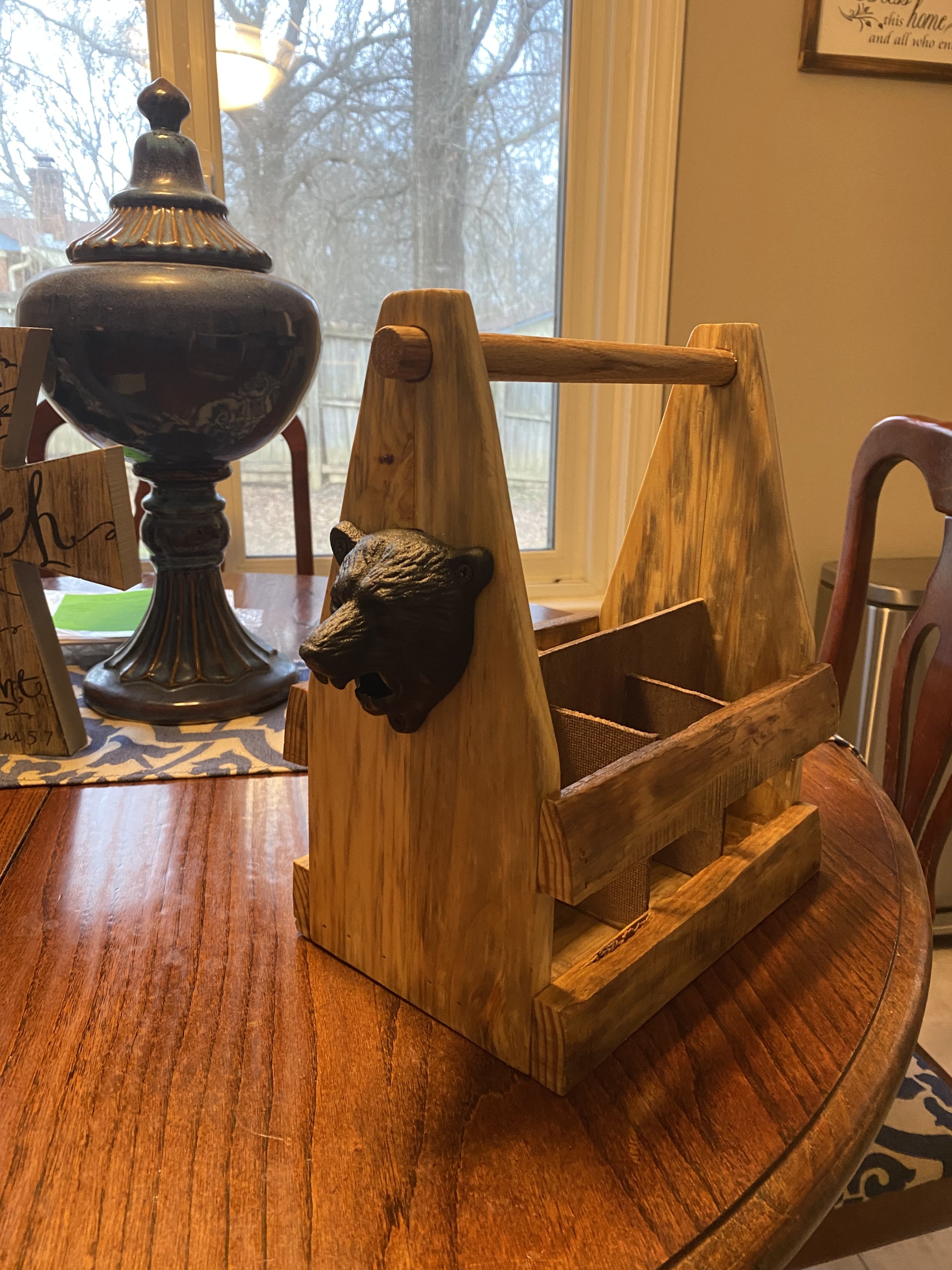 Bottle caddy with bear head opener