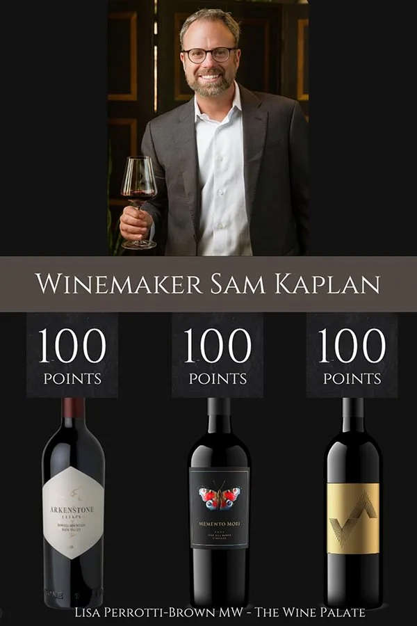 Image of a man with glasses and a beard, smiling and holding a glass of red wine, dressed in a suit. Below him are three wine bottles with labels, each with 100 points, labeled Winemaker Sam Kaplan.