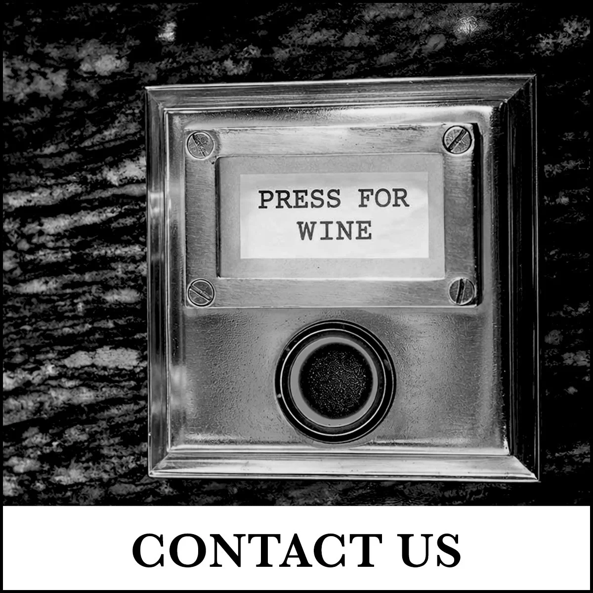 A metal button with a sign above it that reads 'PRESS FOR WINE' and a label below that says 'CONTACT US'.