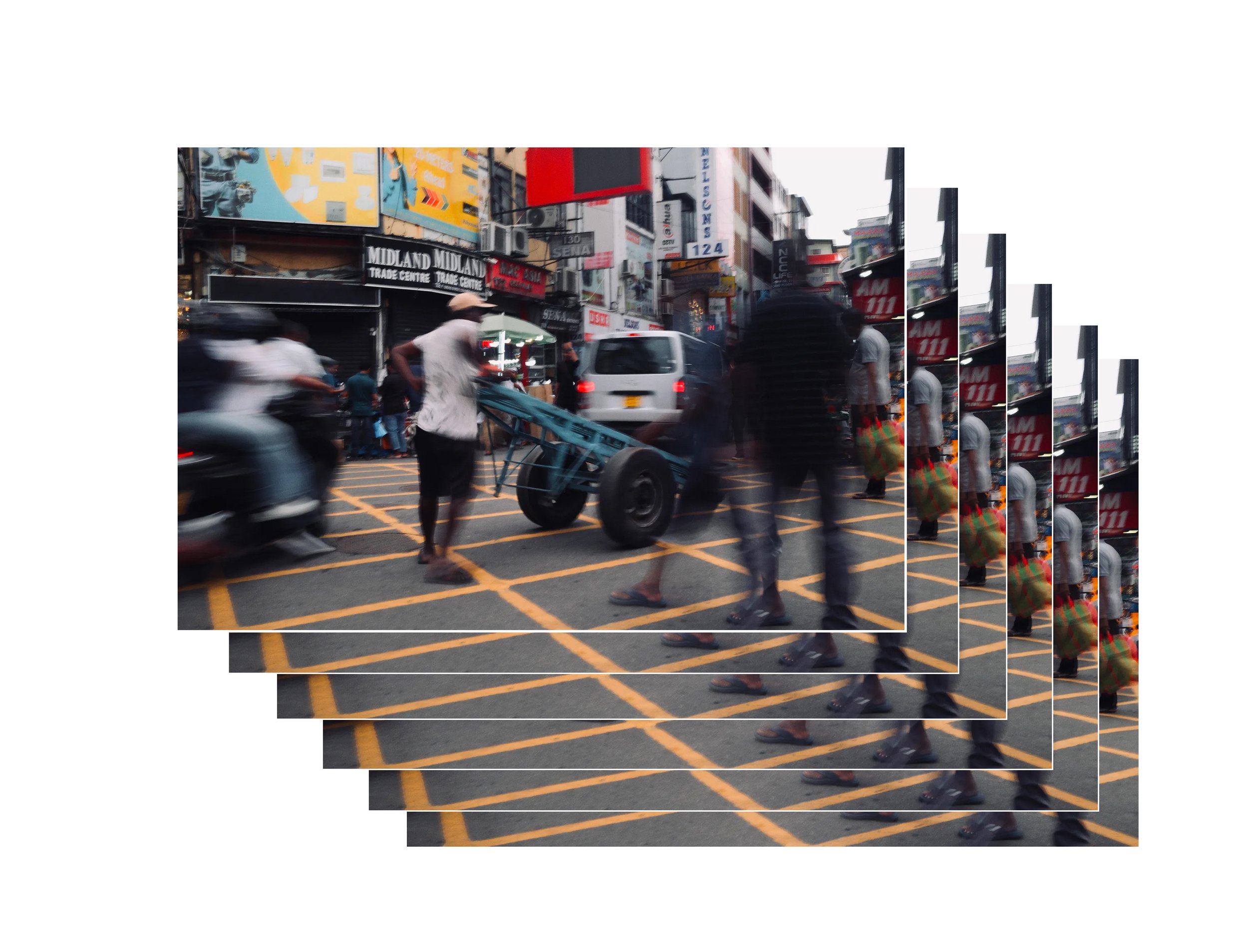 Busy city street with pedestrians, vehicles, and commercial signs and billboards.