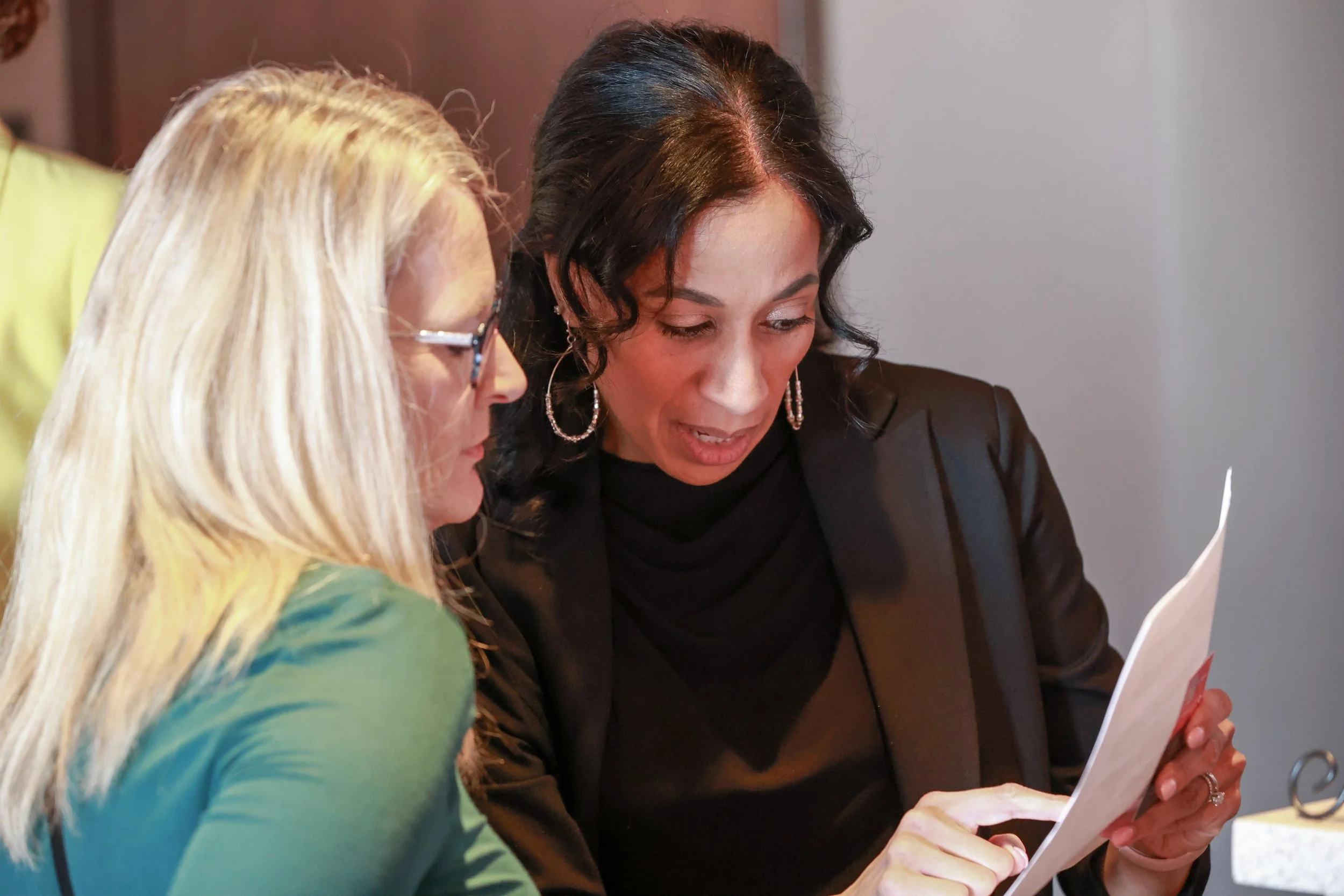 two women speaking to each other at bizlifecon