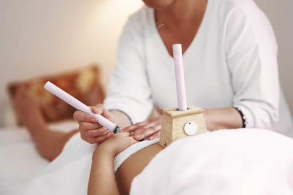 Woman gets moxibustion on hand