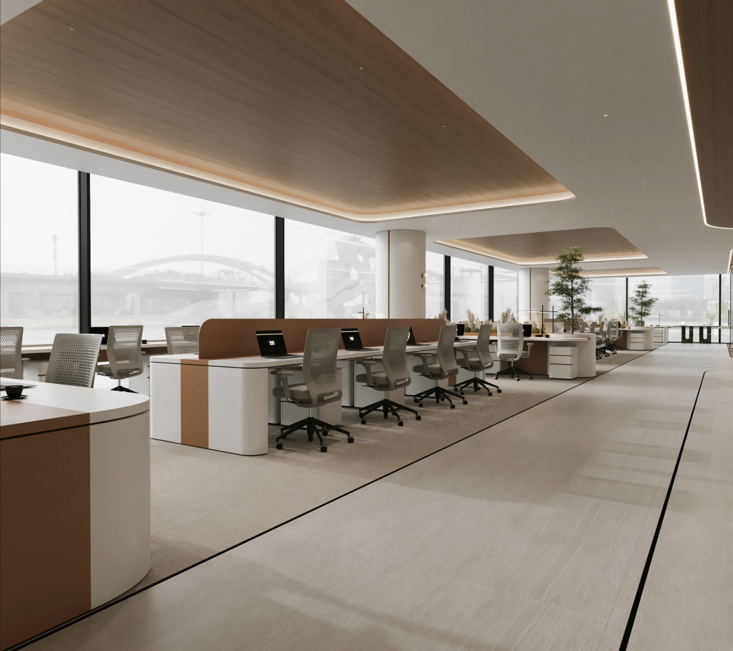 Modern office with large windows, desks, ergonomic chairs, computers, and indoor plants.